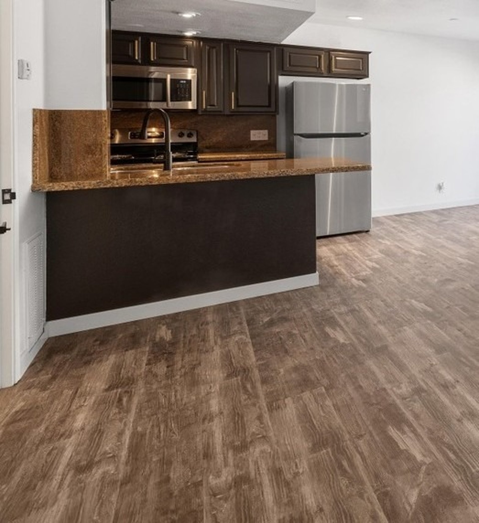 black and brown leather padded tub sofa