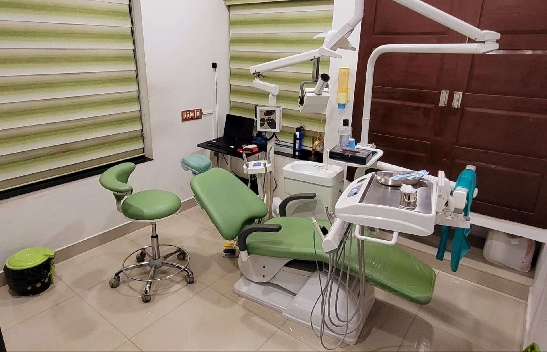 a woman getting her teeth checked by a dentist