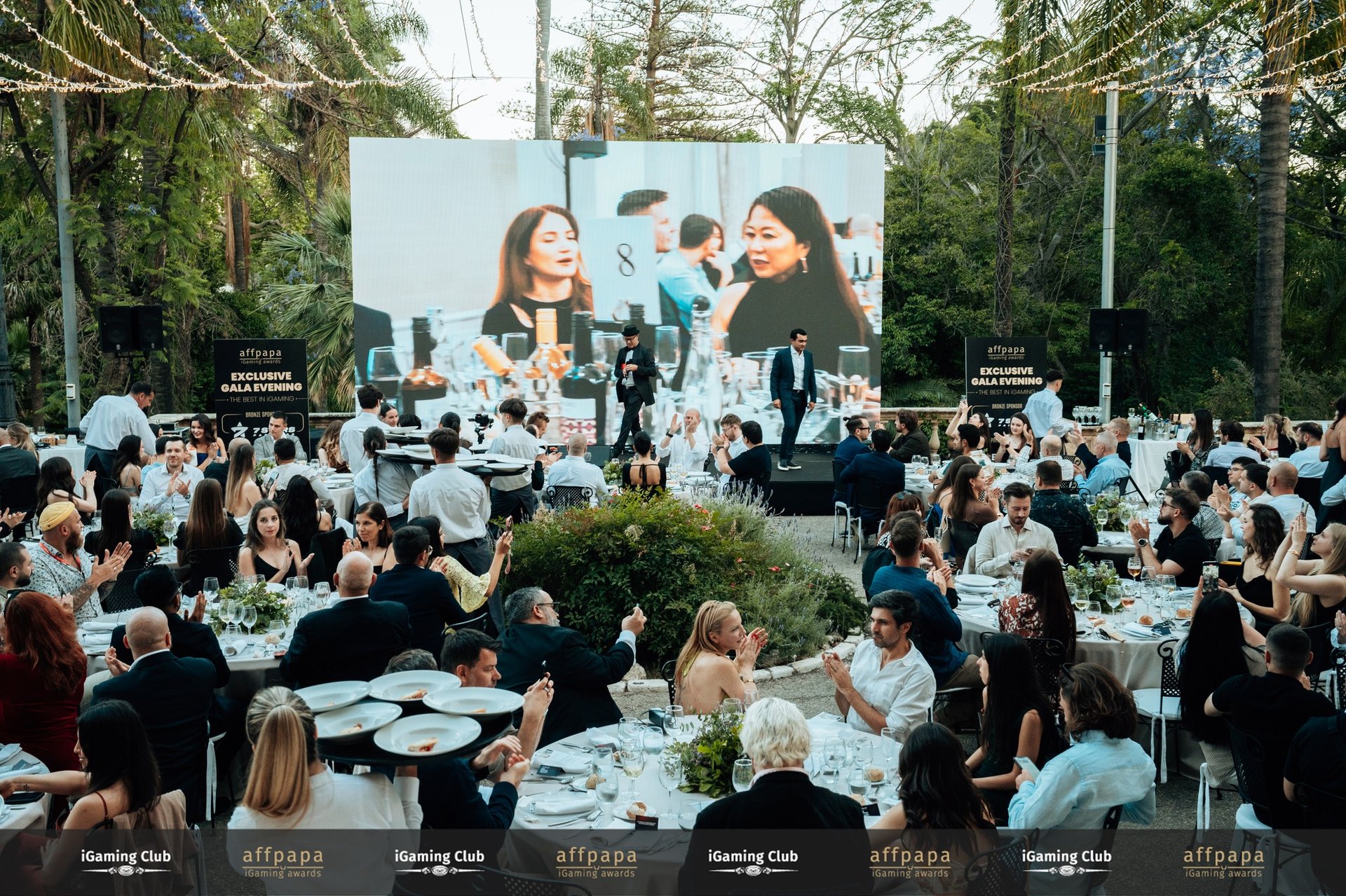 an abstract photo of a curved building with a blue sky in the background