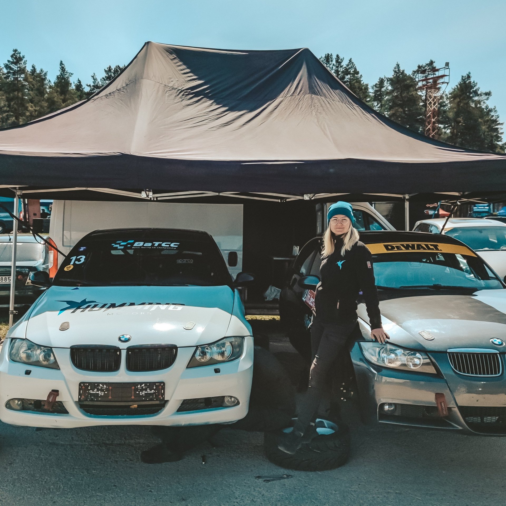 woman wearing yellow long-sleeved dress under white clouds and blue sky during daytime