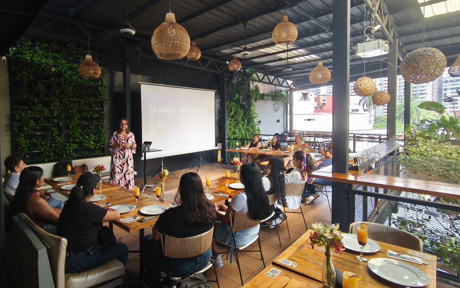 a woman explaining something to a group of people