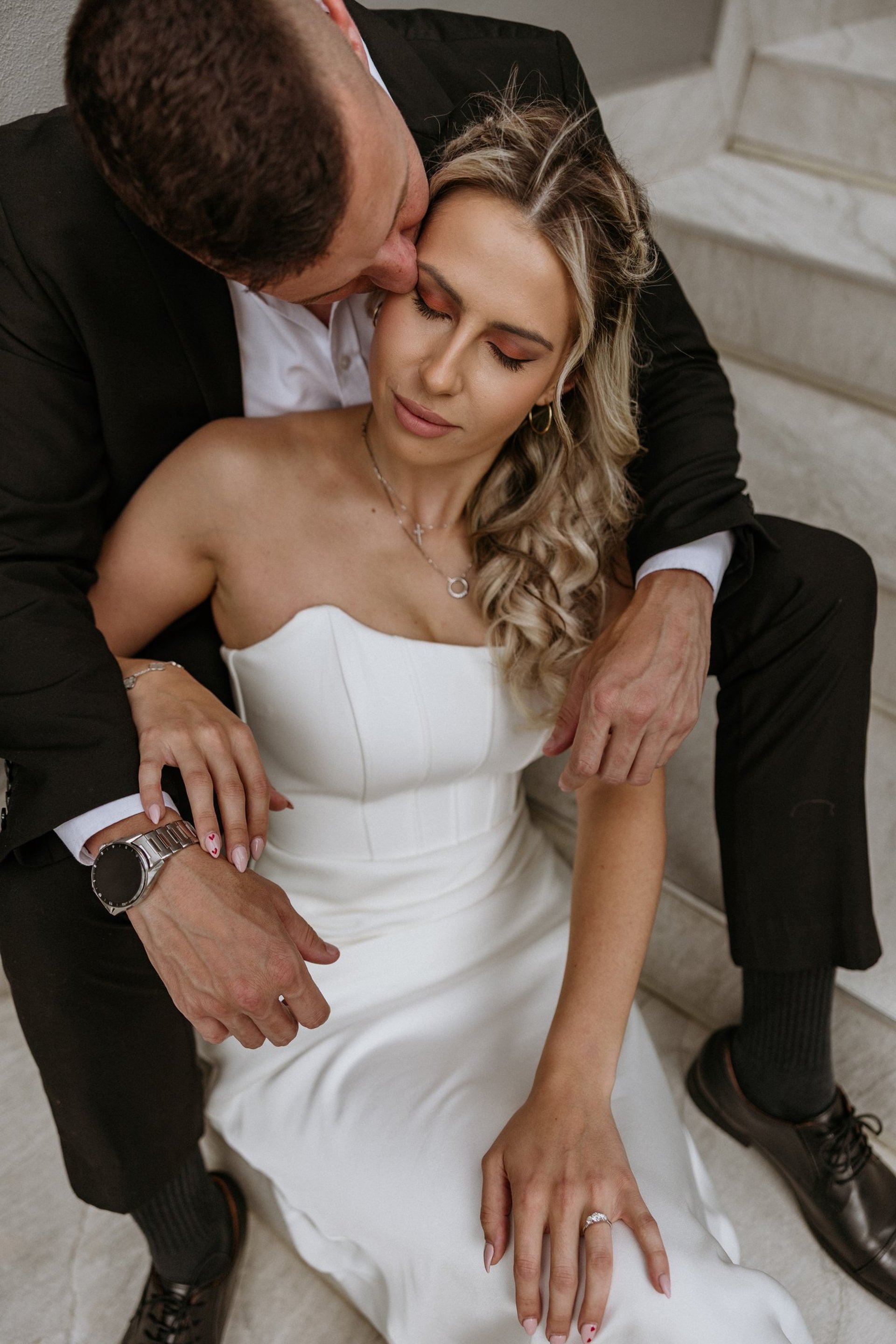 couple wearing silver-colored rings