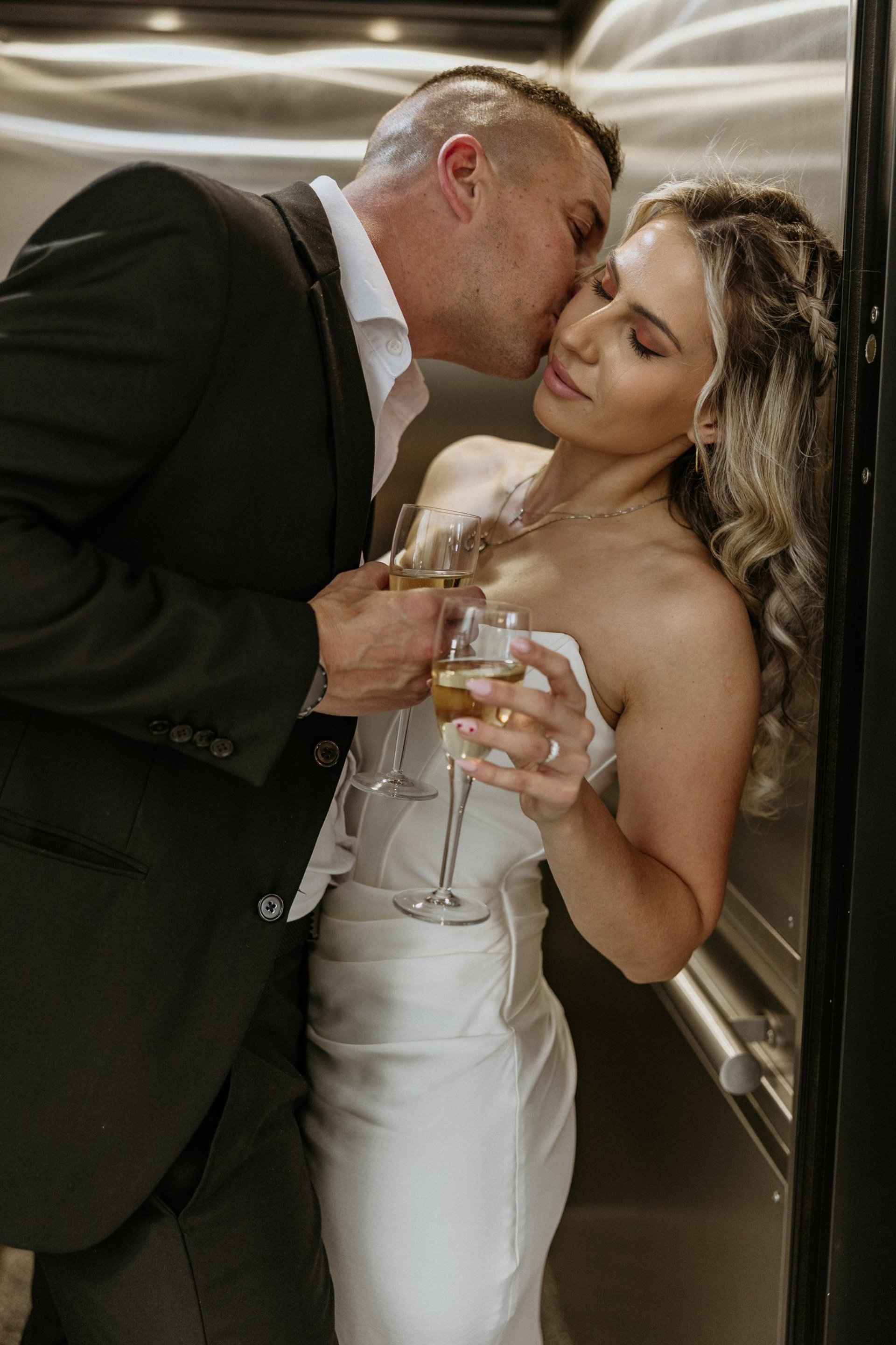 couple wearing silver-colored rings