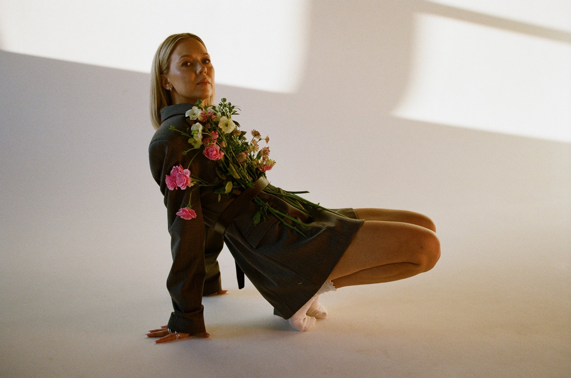 person wearing grey knit sweater