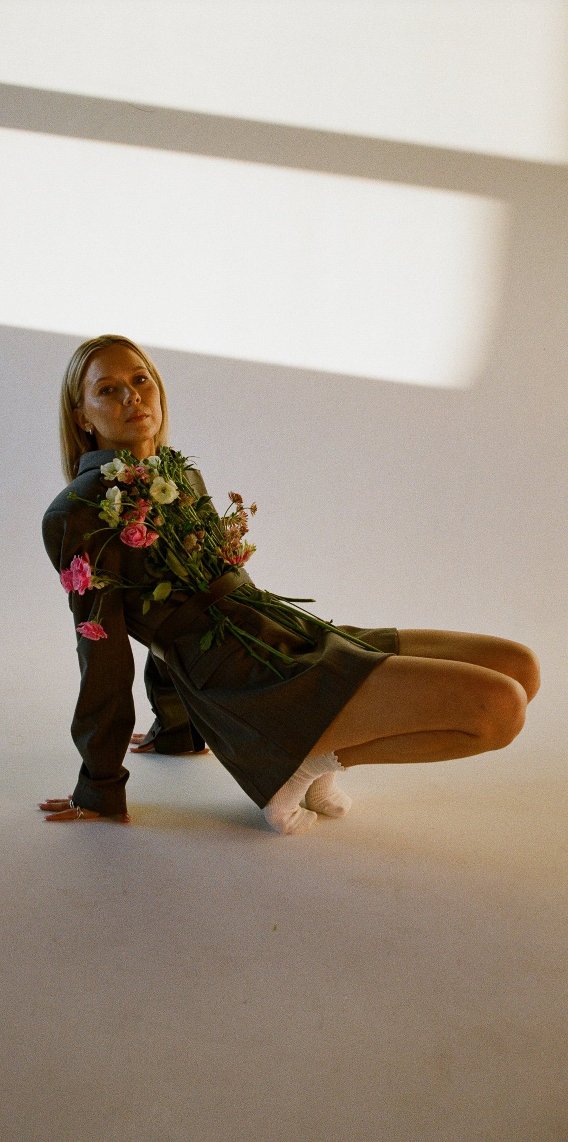 person wearing grey knit sweater