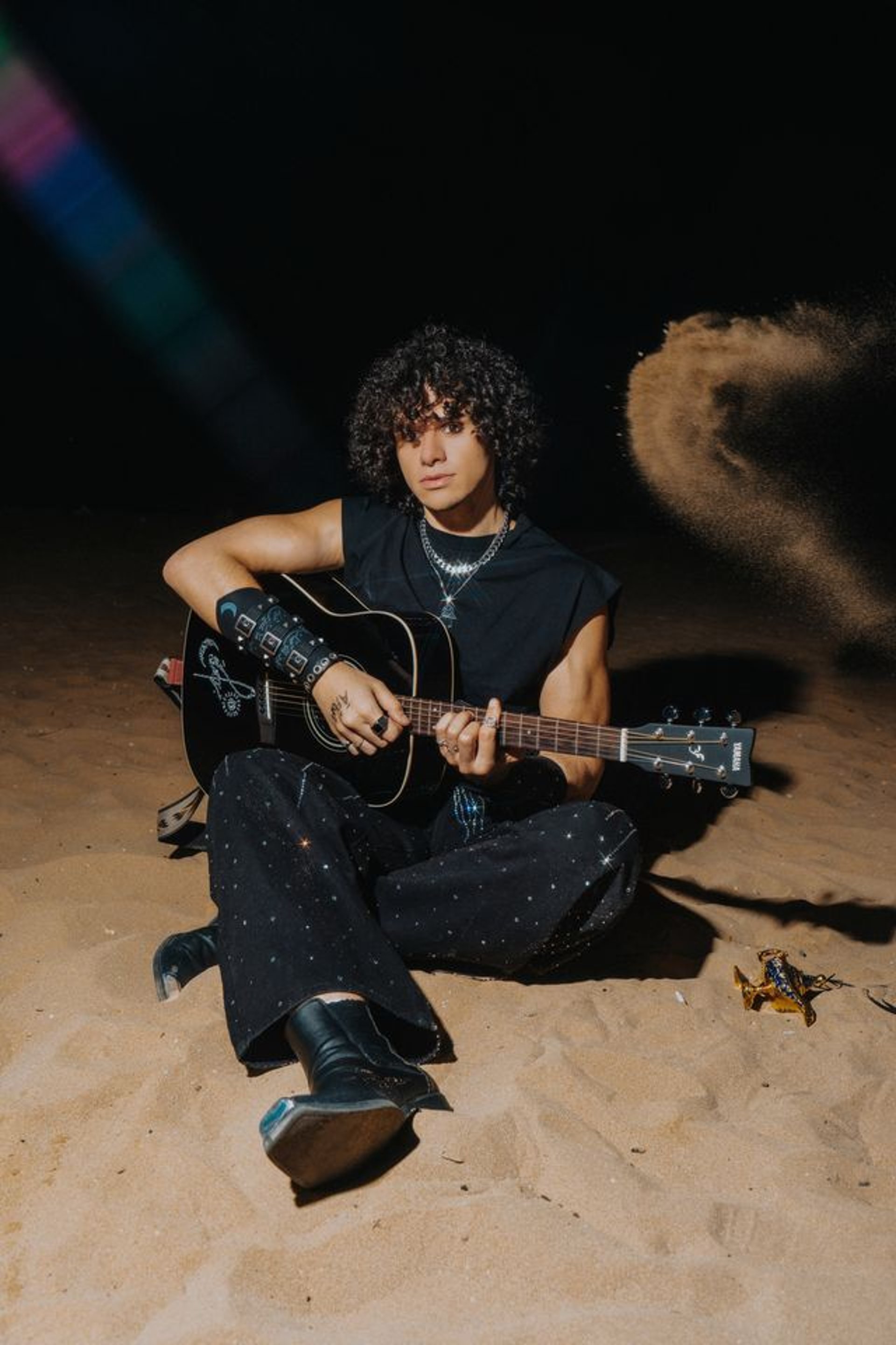 a close up of a black and brown abstract painting