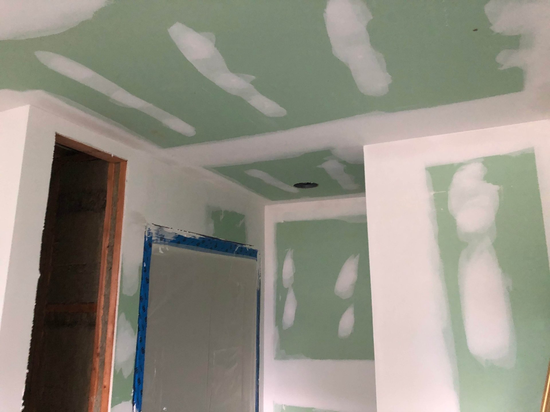 drywall finisher taping drywall