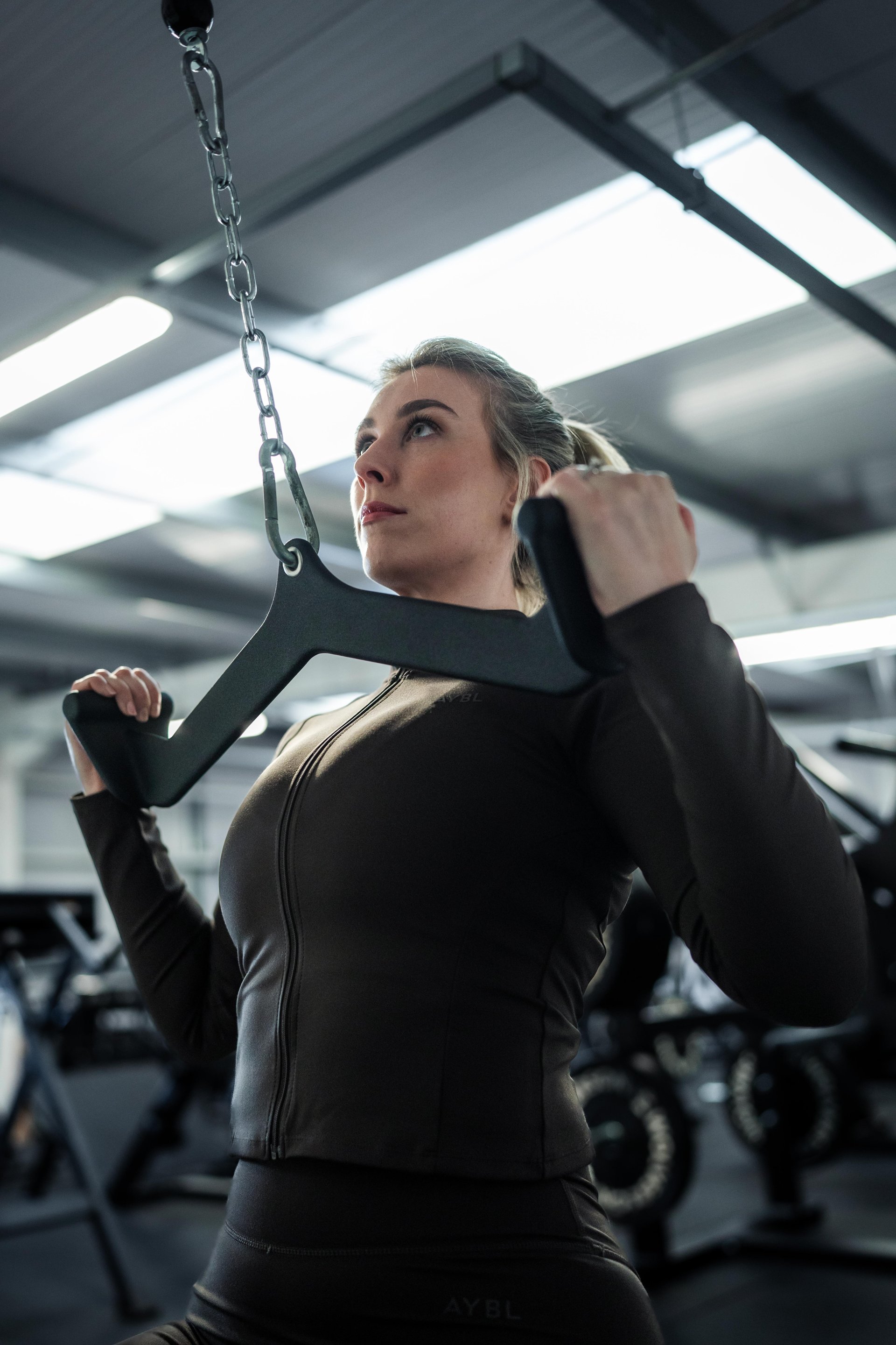 woman wearing yellow long-sleeved dress under white clouds and blue sky during daytime