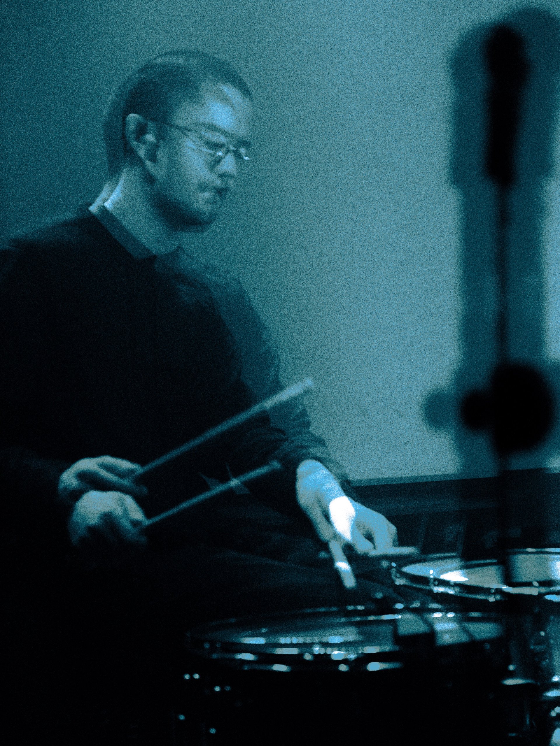 an abstract photo of a curved building with a blue sky in the background