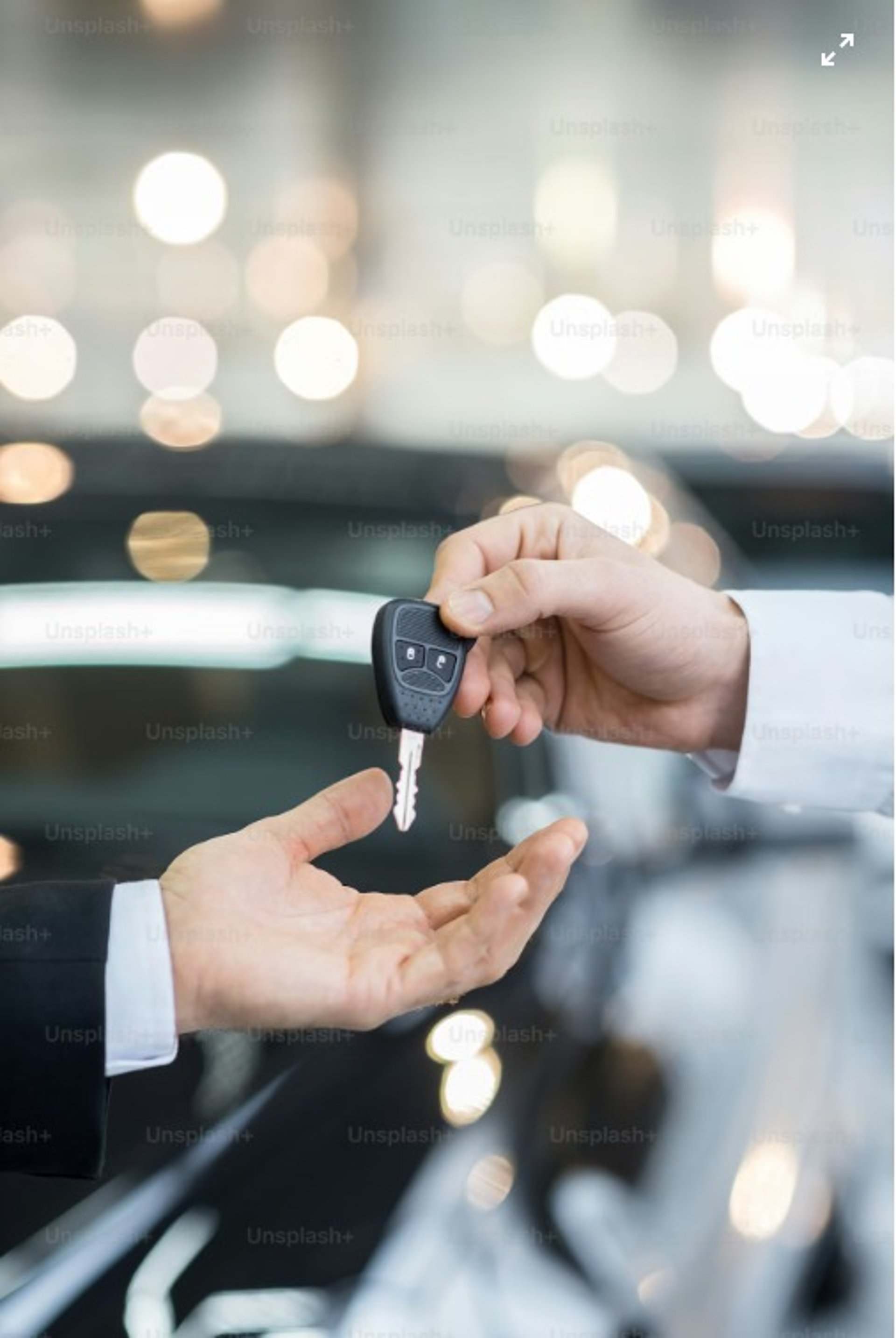 an abstract photo of a curved building with a blue sky in the background