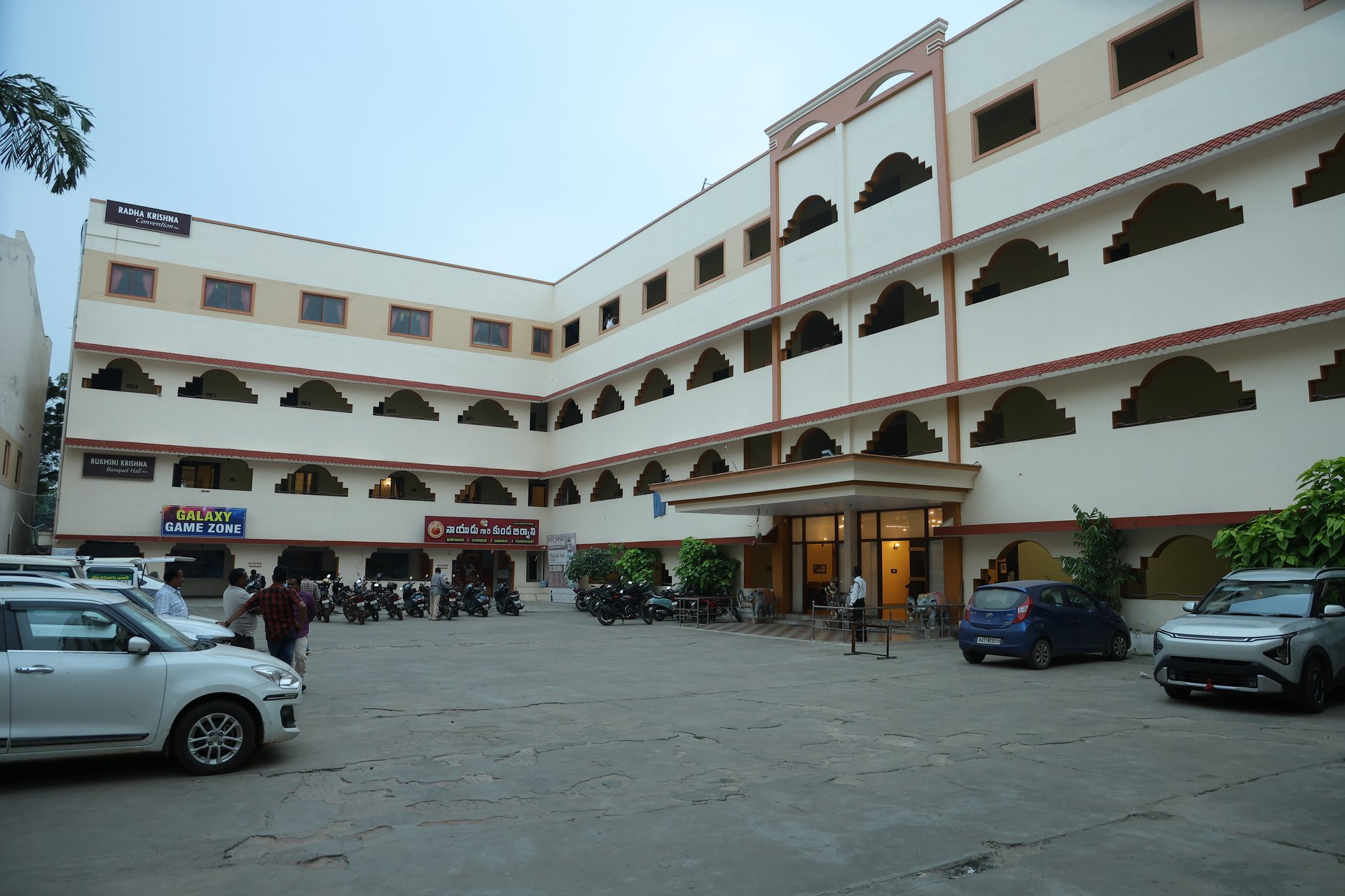 an abstract photo of a curved building with a blue sky in the background