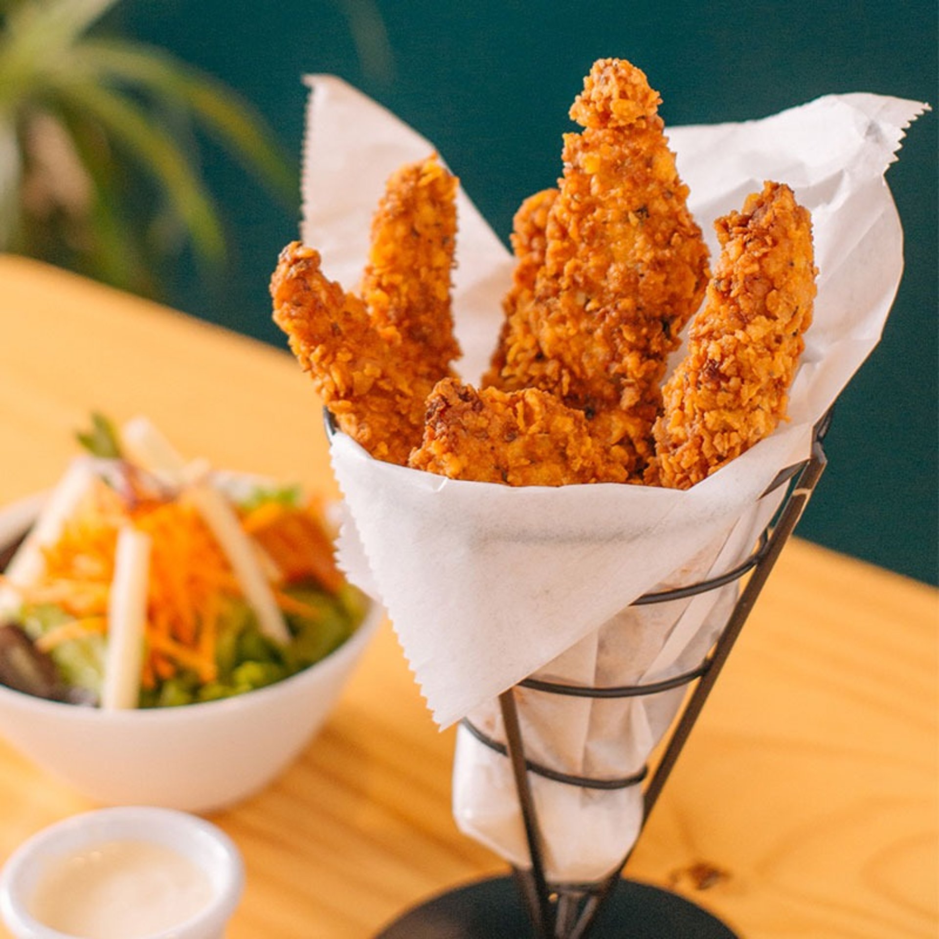 an abstract photo of a curved building with a blue sky in the background