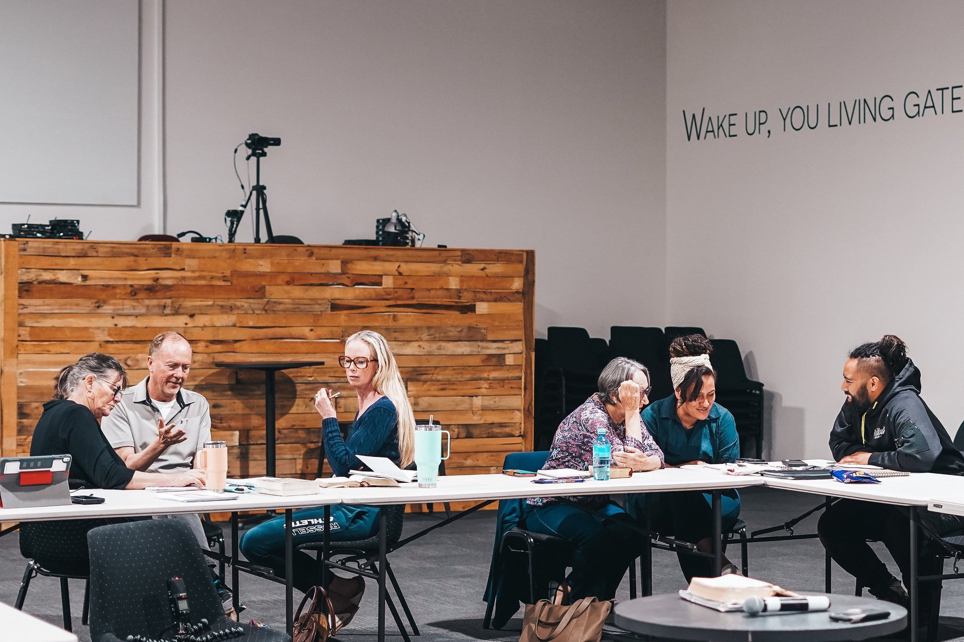 an abstract photo of a curved building with a blue sky in the background