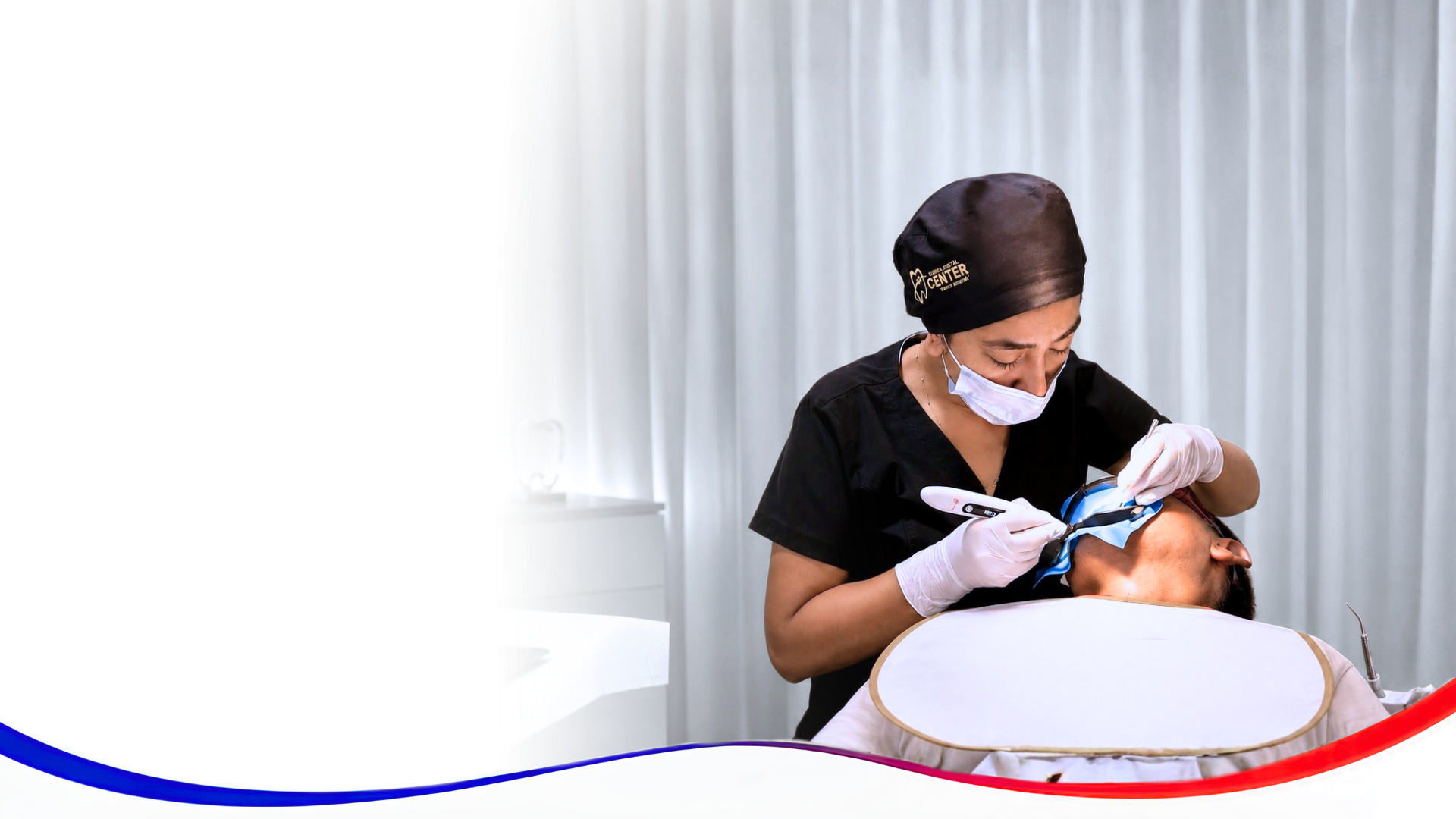Dentist cleaning patient's teeth with tools.