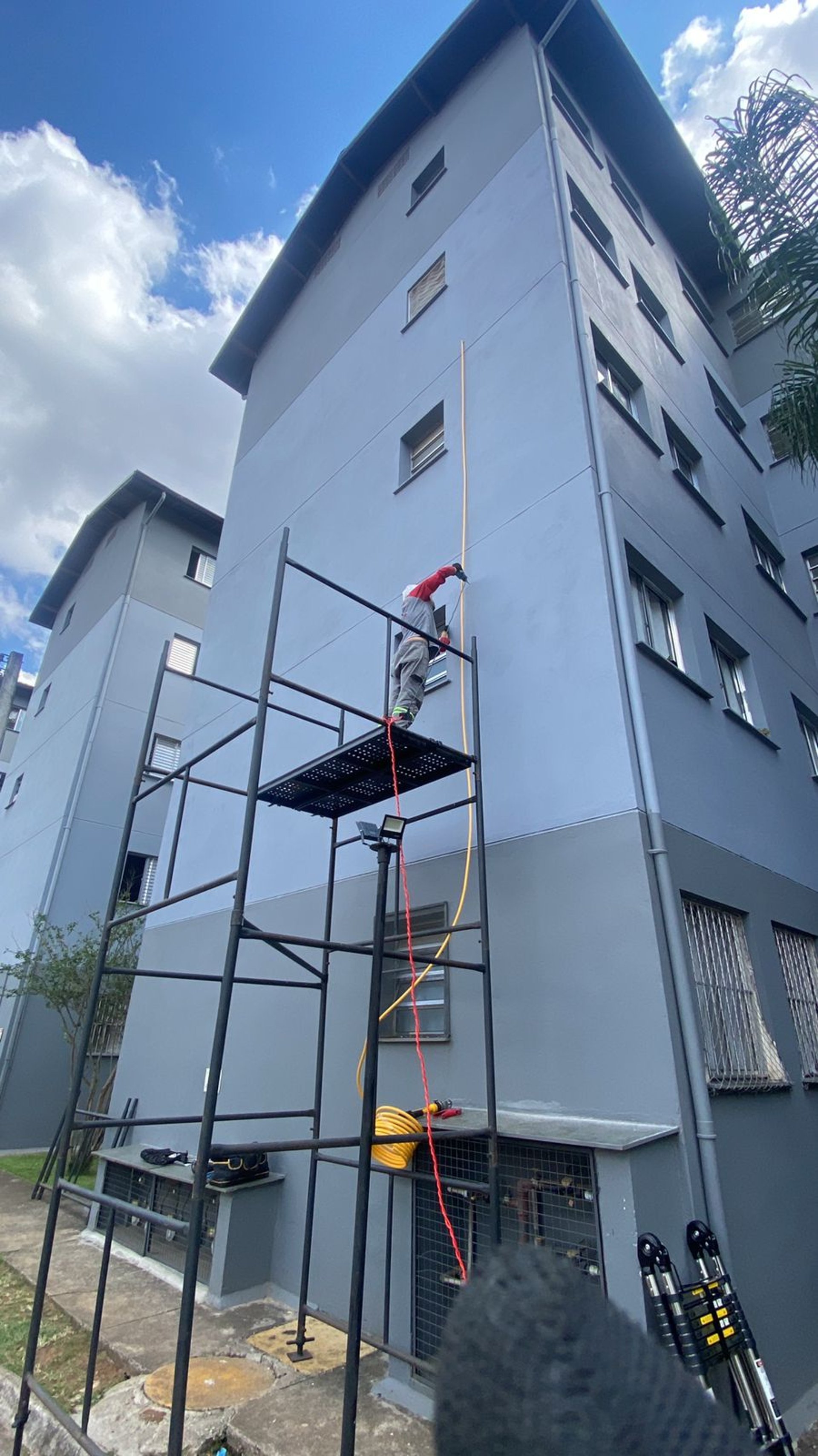 an abstract photo of a curved building with a blue sky in the background