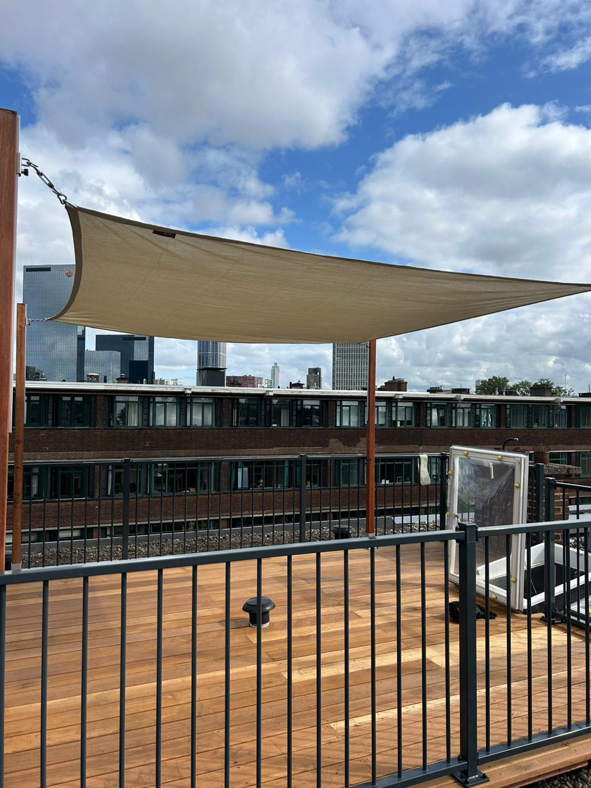 an abstract photo of a curved building with a blue sky in the background