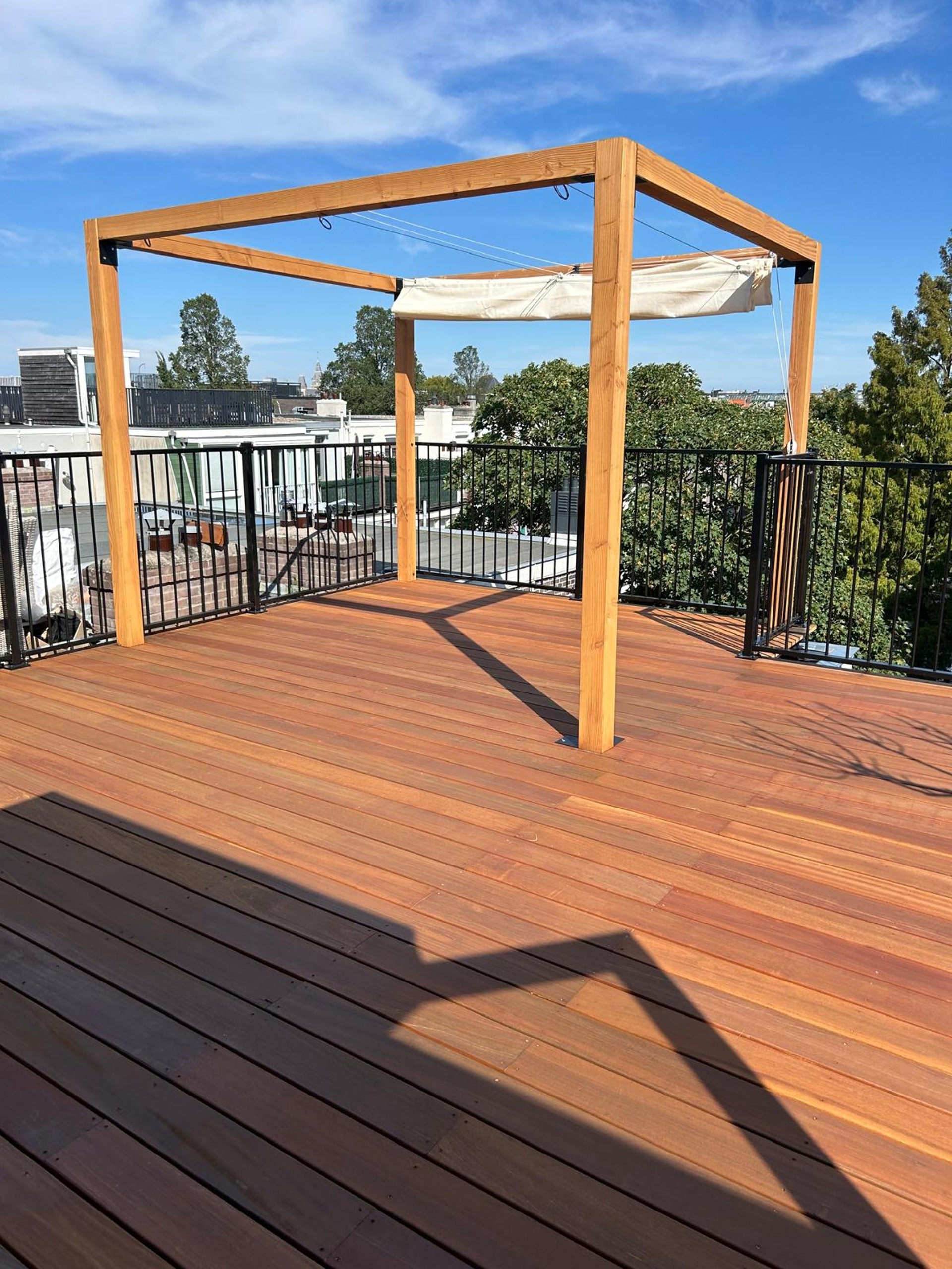 an abstract photo of a curved building with a blue sky in the background