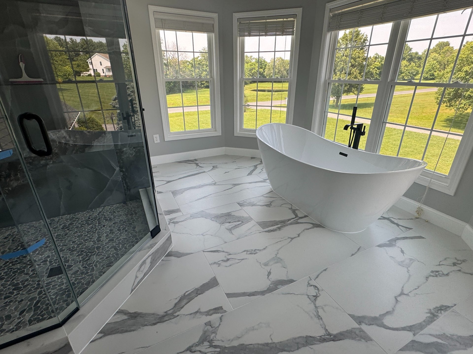 an abstract photo of a curved building with a blue sky in the background