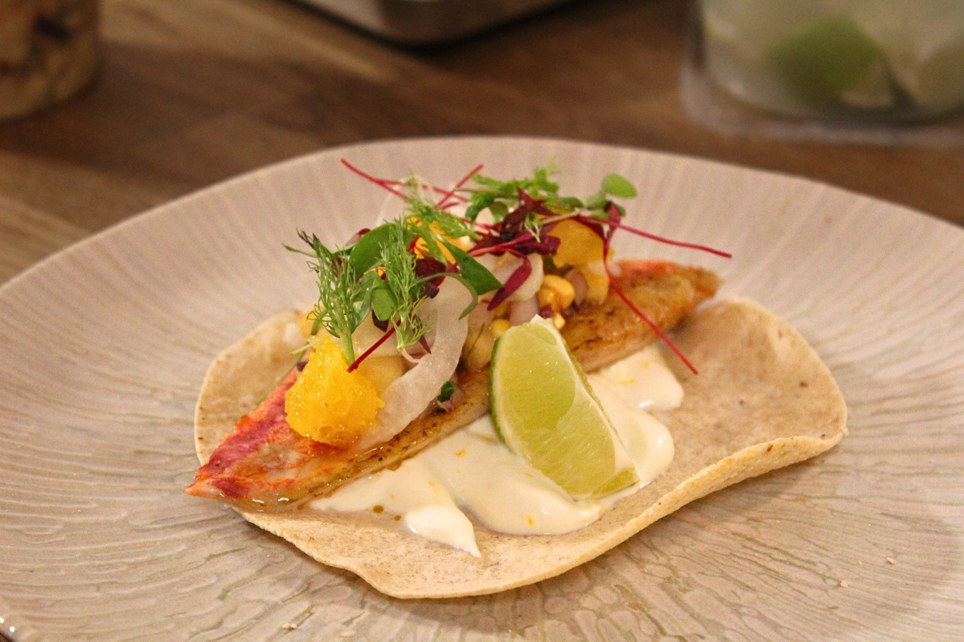 a table set with plates and wine glasses