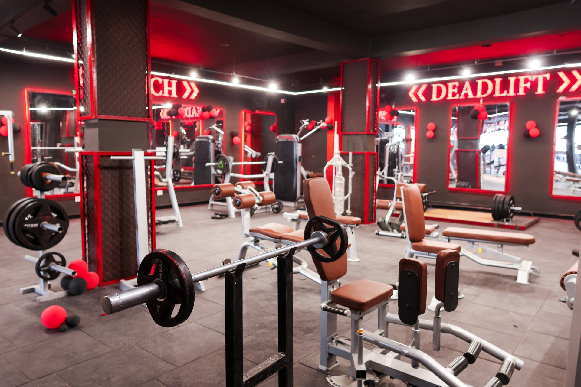 topless man in black pants holding black and yellow exercise equipment