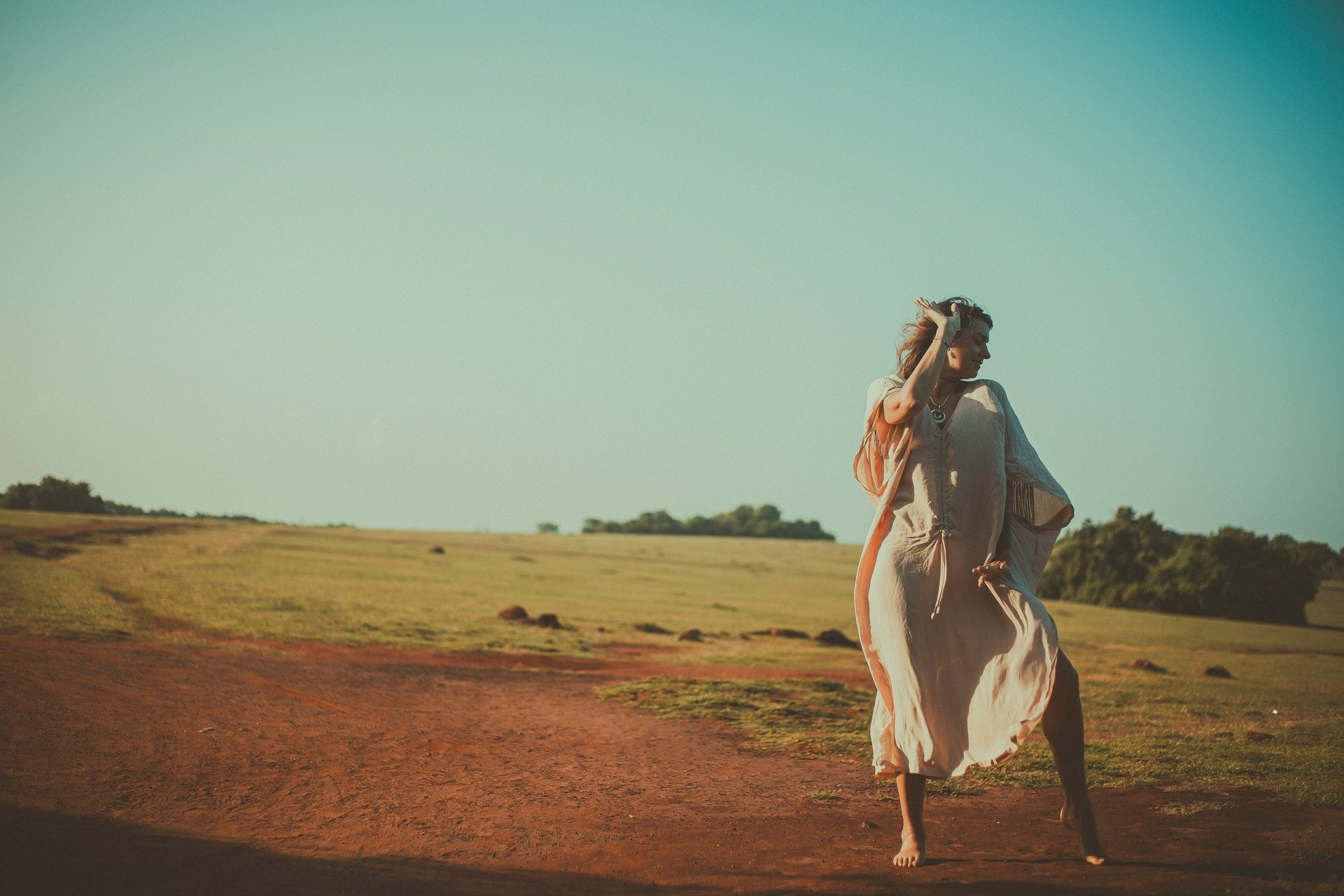an abstract photo of a curved building with a blue sky in the background