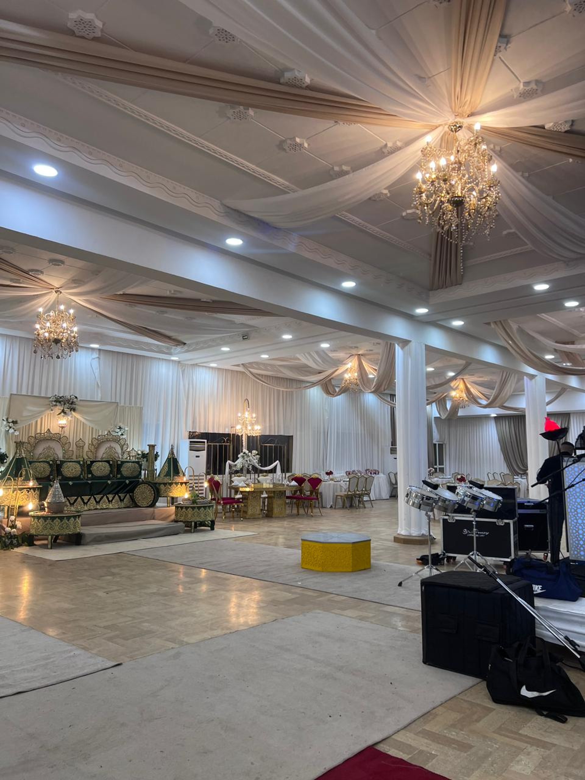 an abstract photo of a curved building with a blue sky in the background