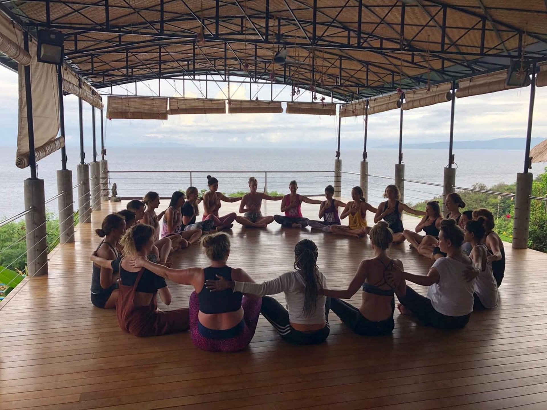 woman wearing yellow long-sleeved dress under white clouds and blue sky during daytime