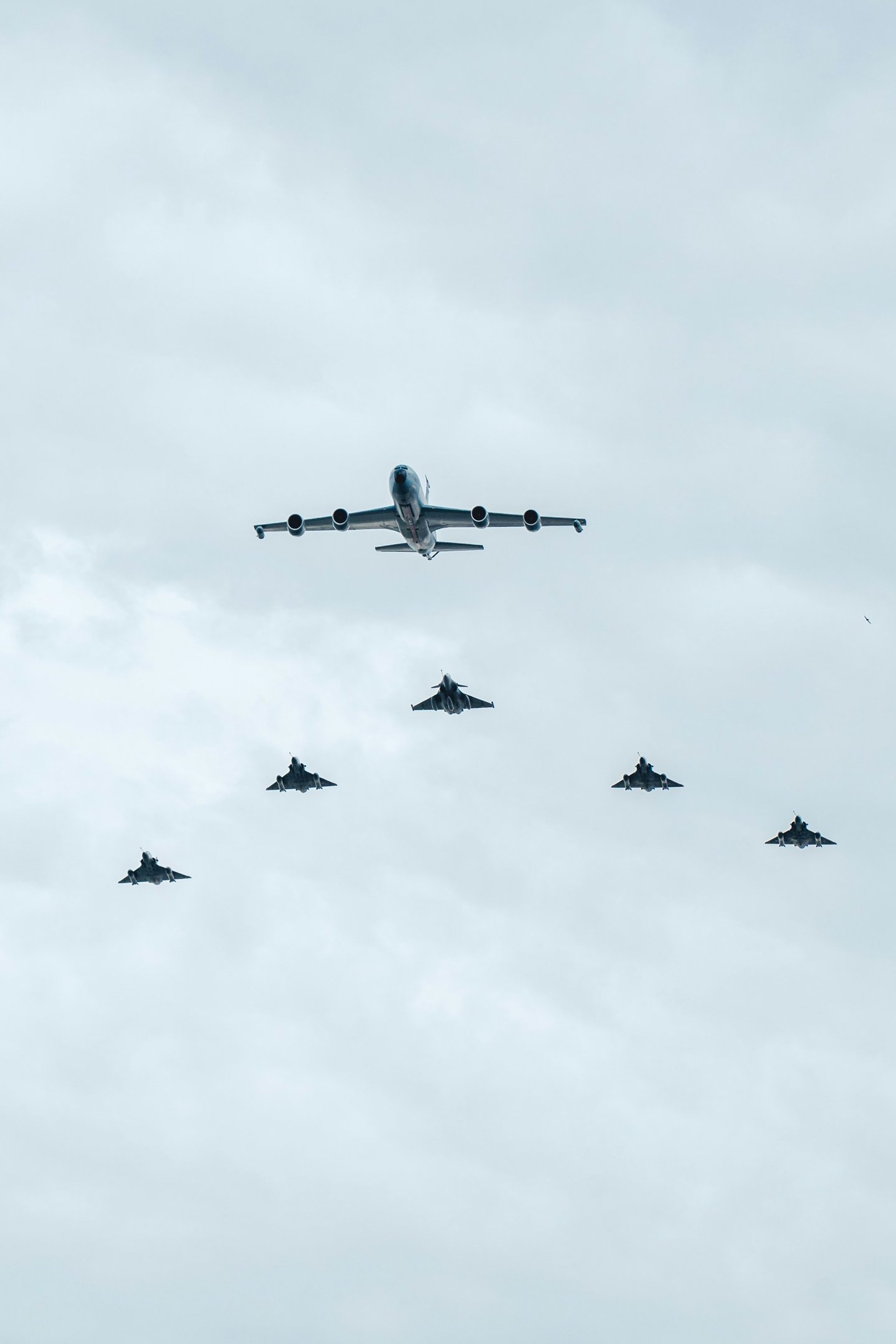 an abstract photo of a curved building with a blue sky in the background