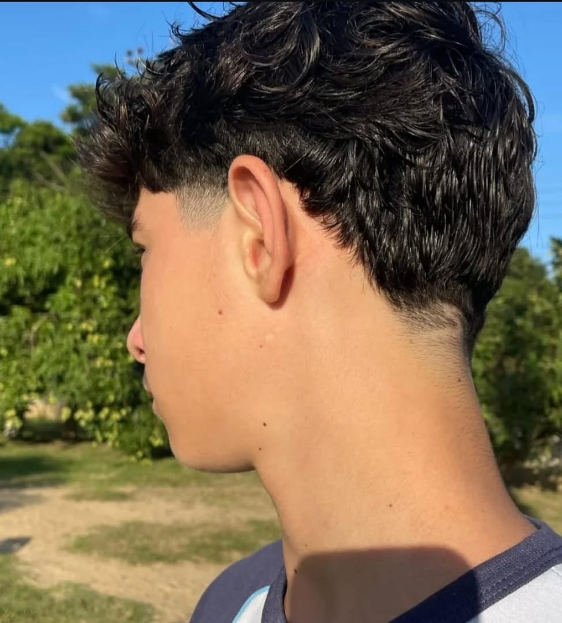 man in black shirt with tattoo on his left arm