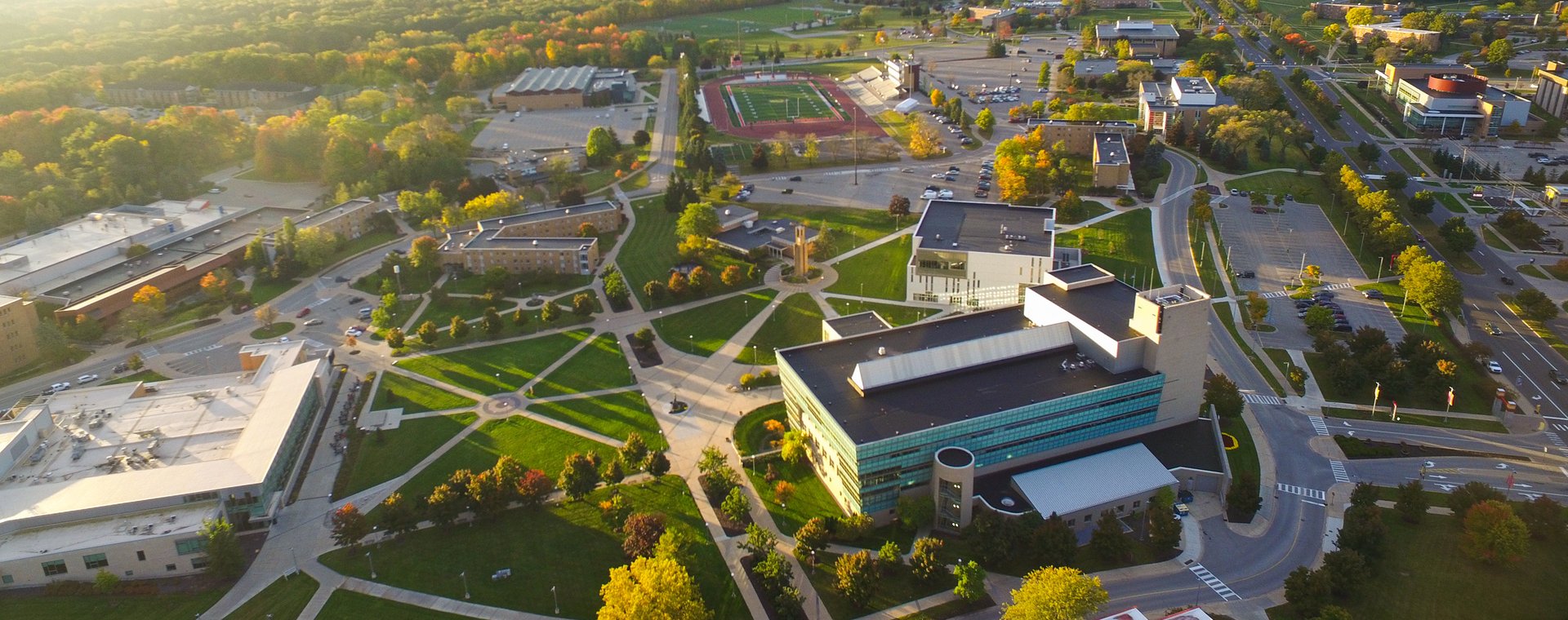person holding red round medication pill