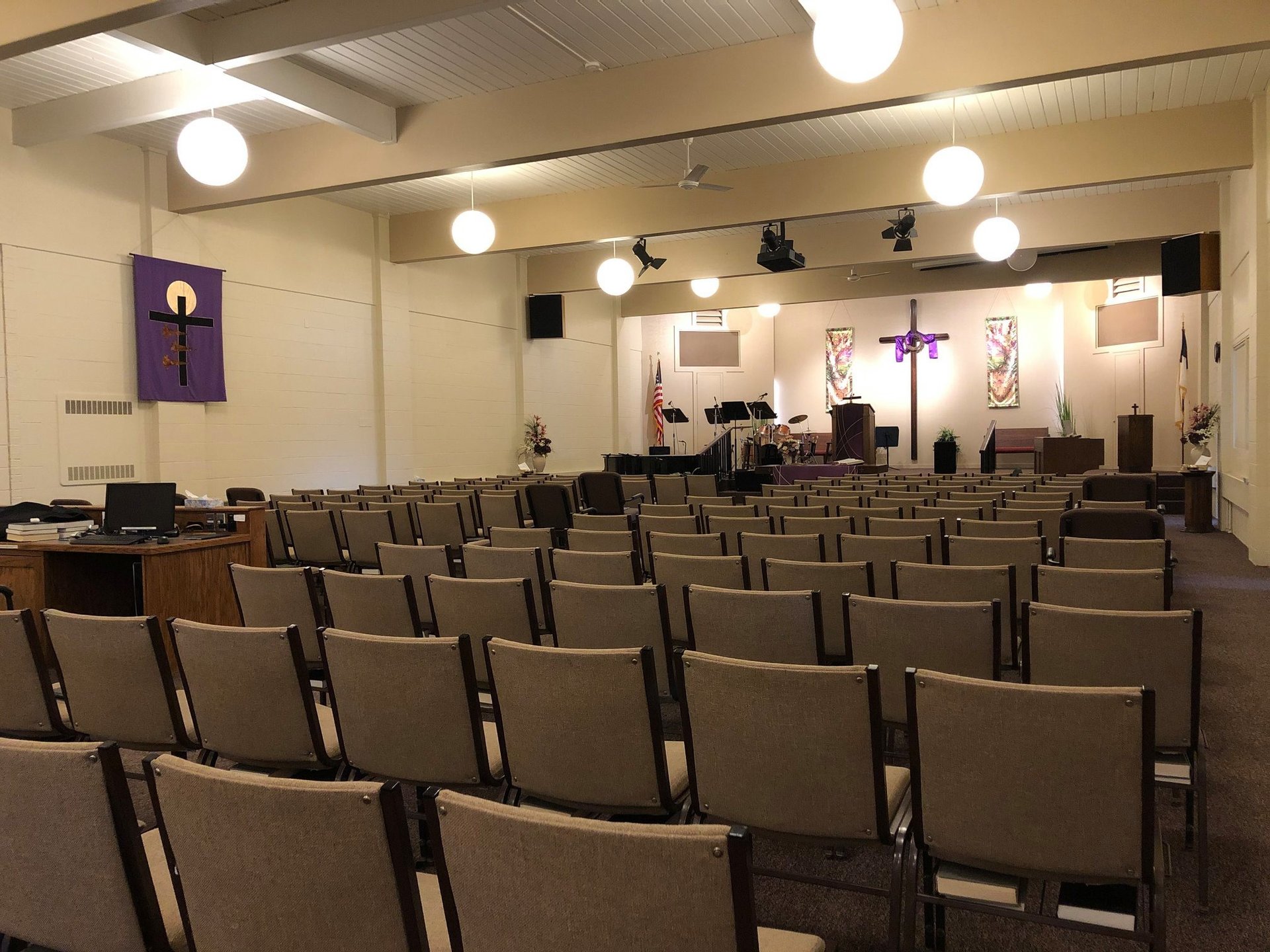 person holding red round medication pill