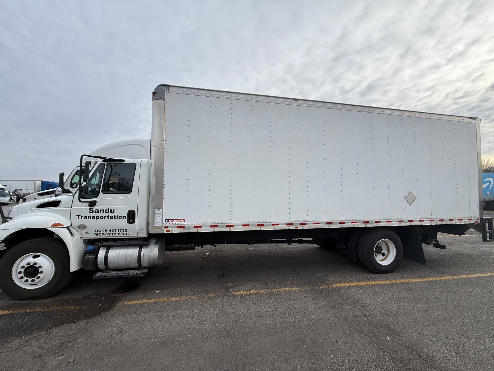 woman wearing yellow long-sleeved dress under white clouds and blue sky during daytime