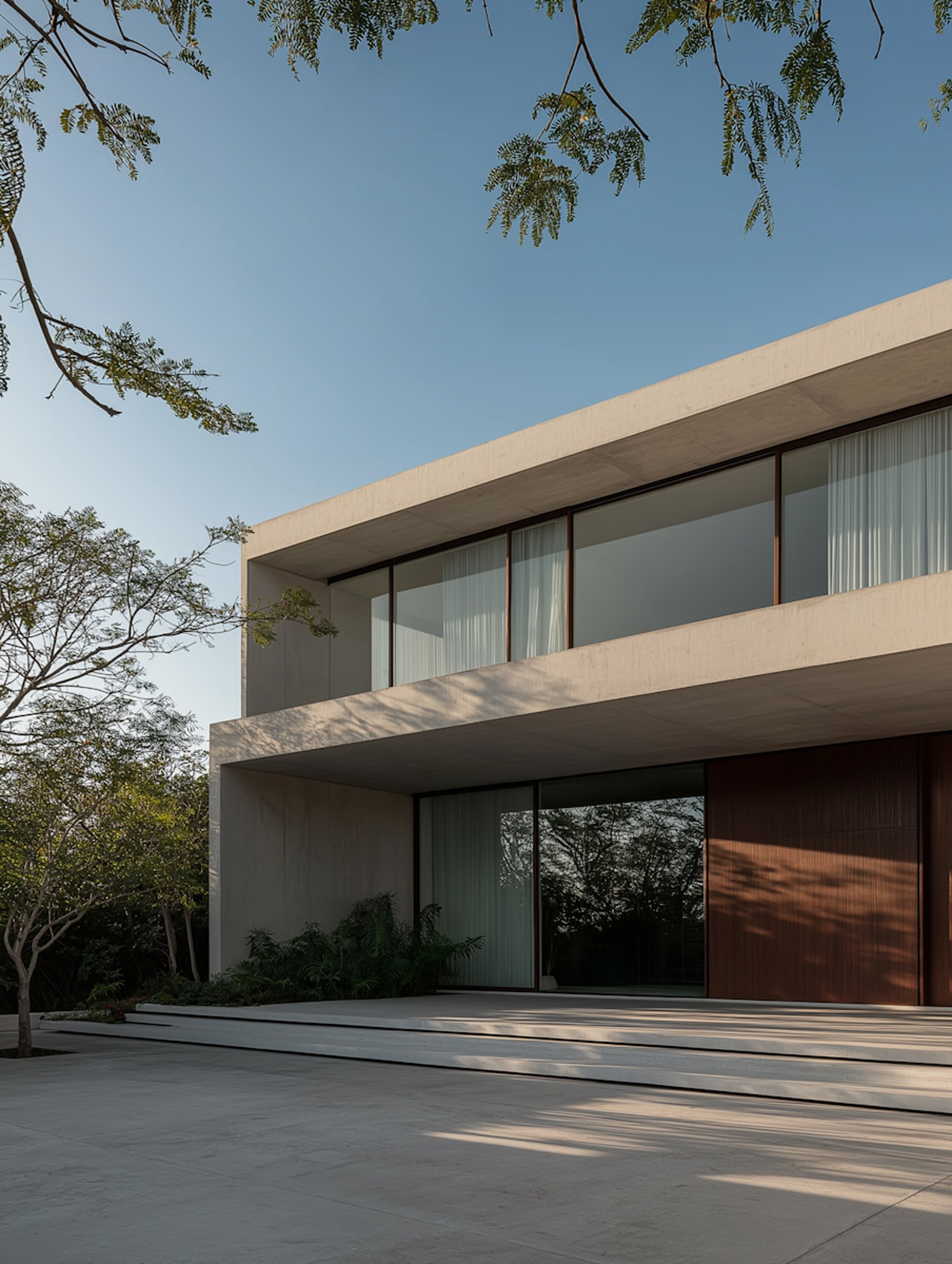 an abstract photo of a curved building with a blue sky in the background