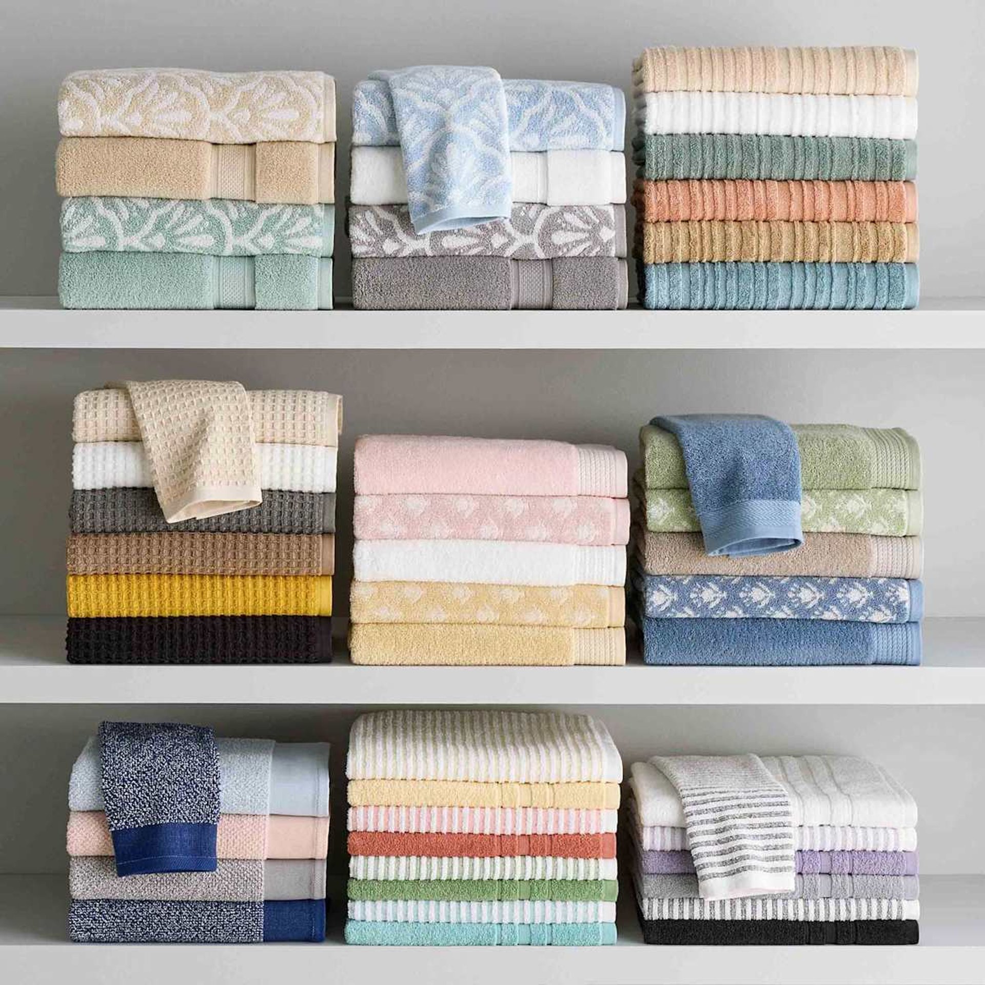 white bed with gray and white bed linen