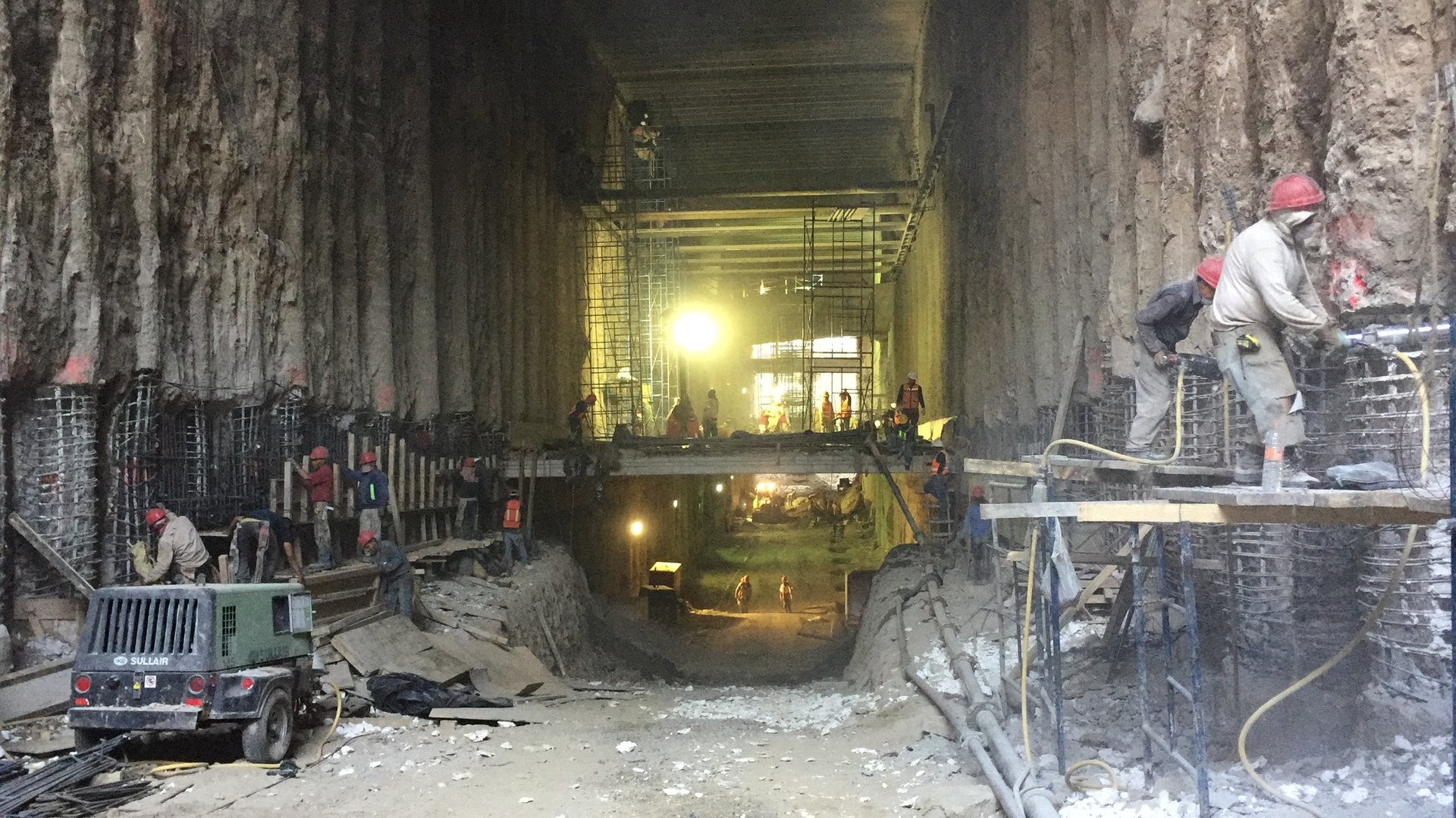 black and brown leather padded tub sofa