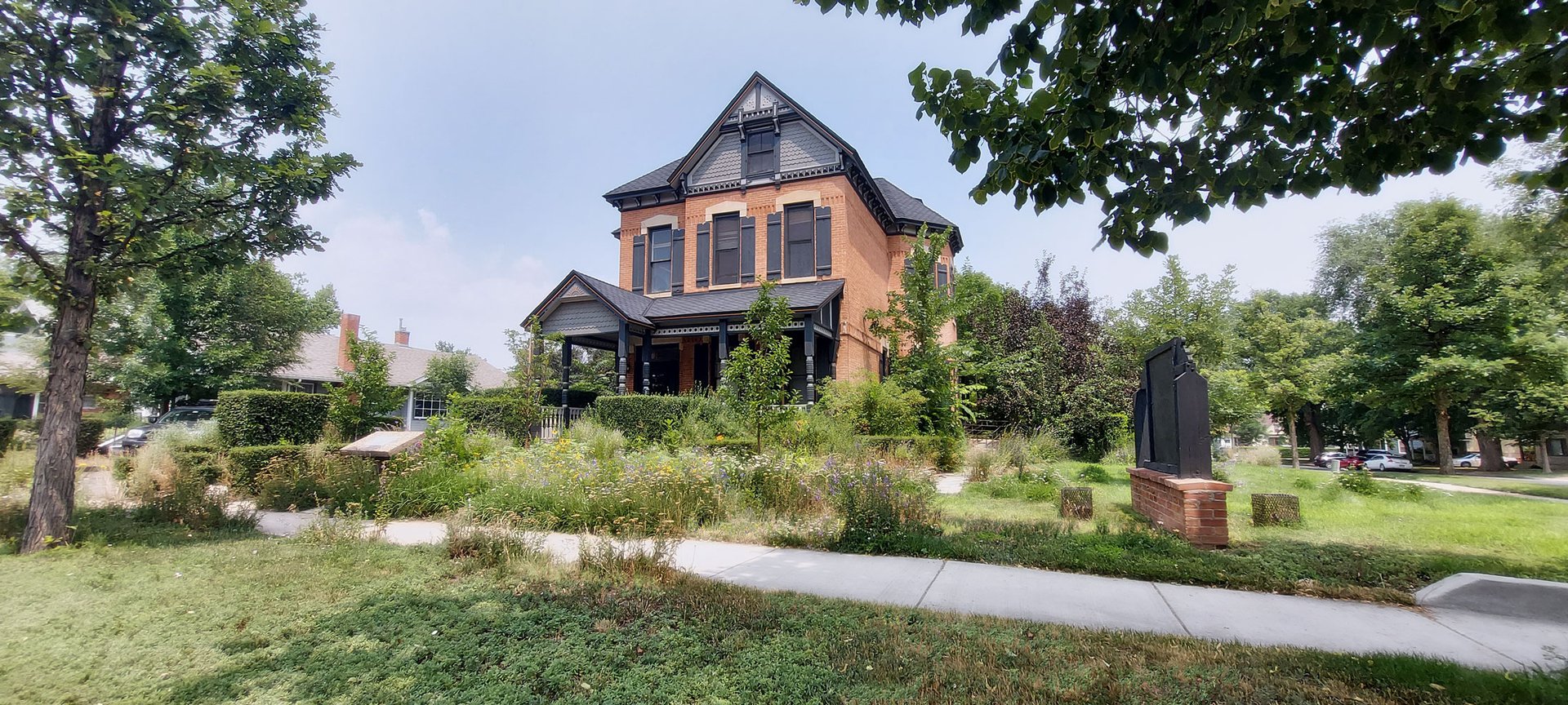 woman wearing yellow long-sleeved dress under white clouds and blue sky during daytime