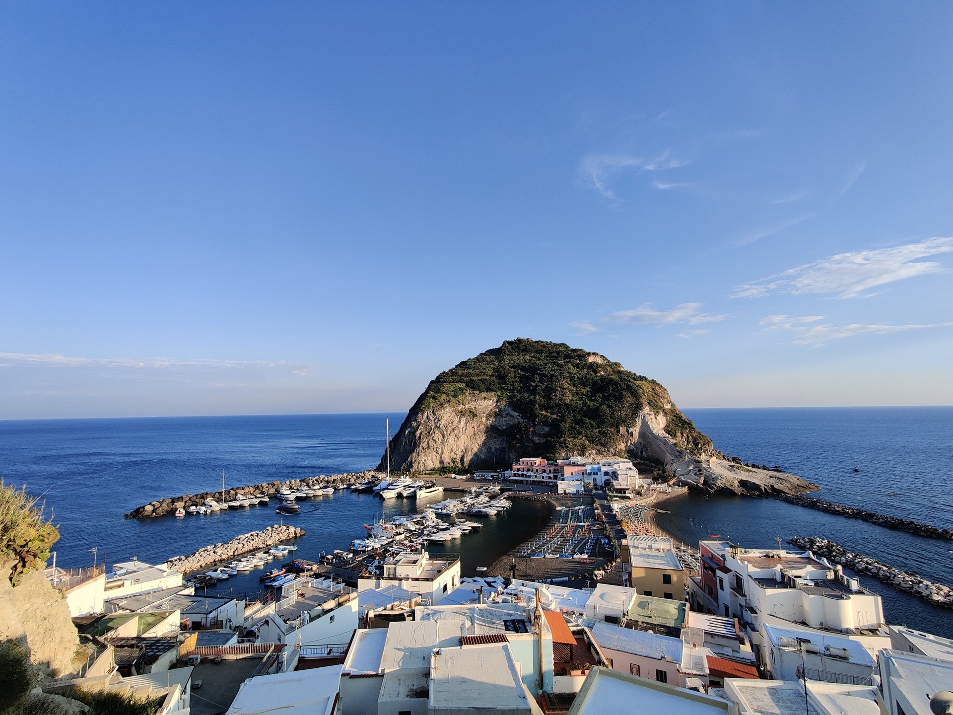 woman wearing yellow long-sleeved dress under white clouds and blue sky during daytime