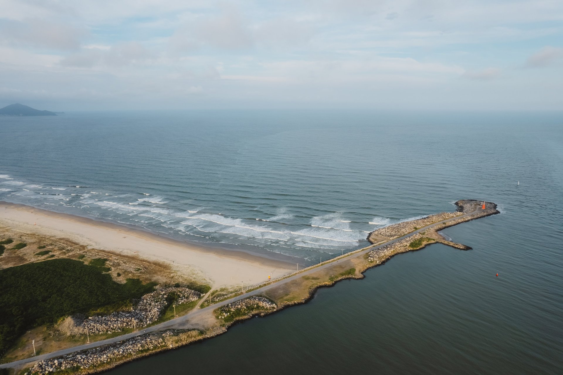 an abstract photo of a curved building with a blue sky in the background