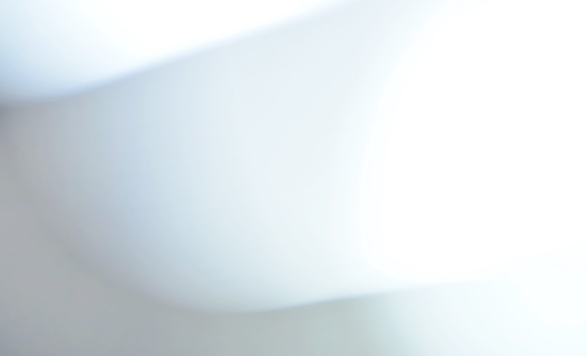 a close up of a white wall with wavy lines