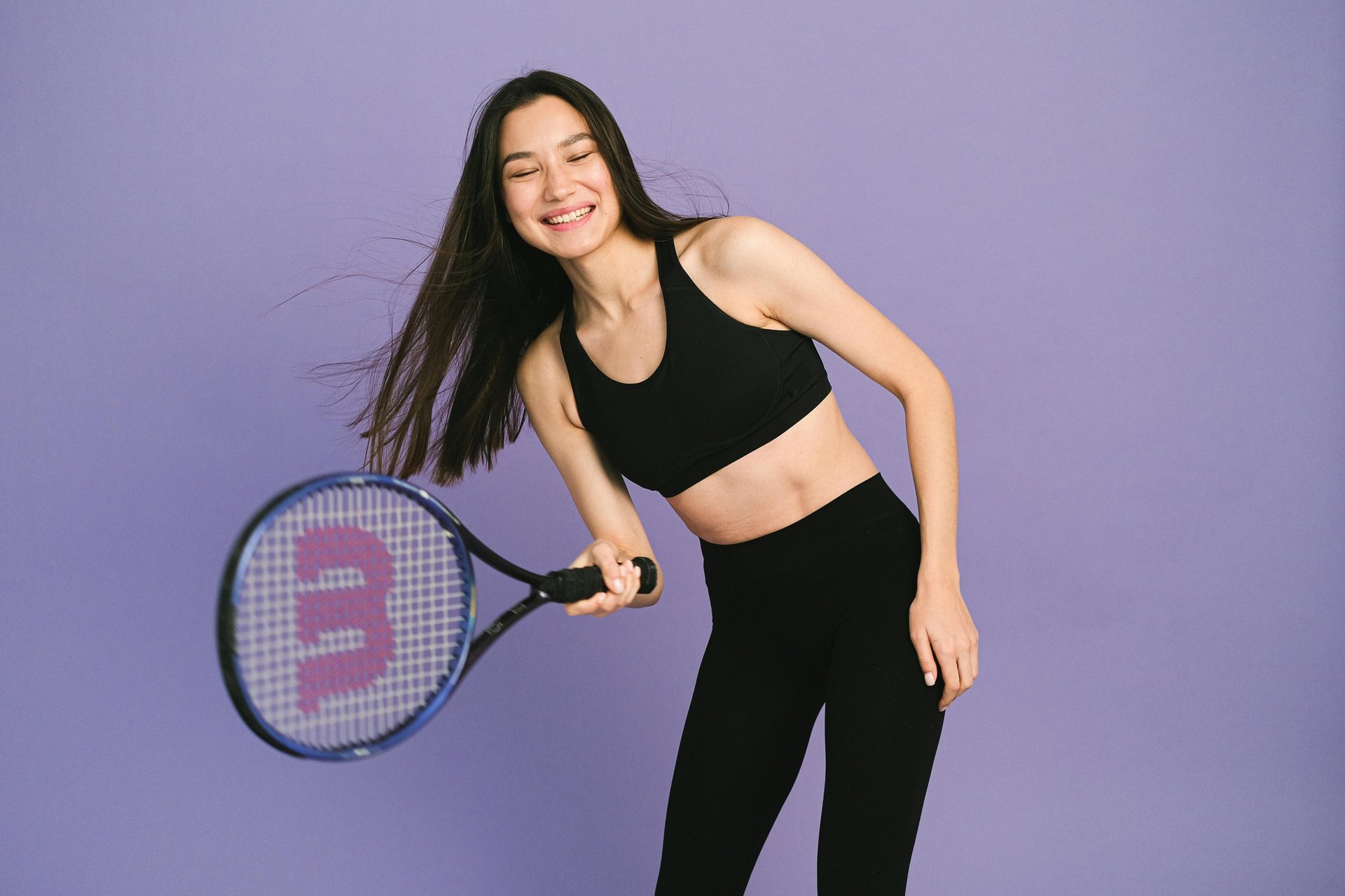 an abstract photo of a curved building with a blue sky in the background