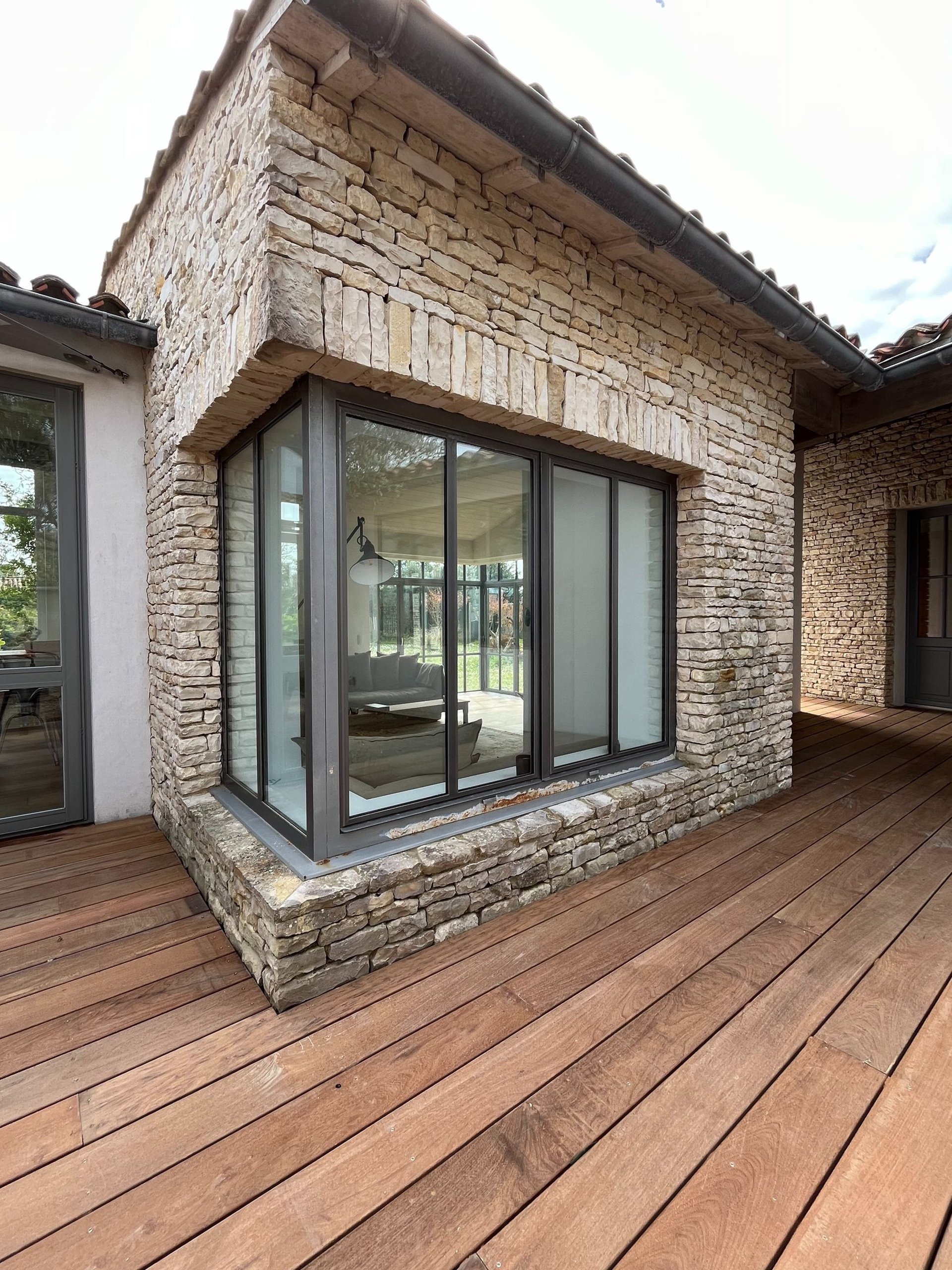 an abstract photo of a curved building with a blue sky in the background