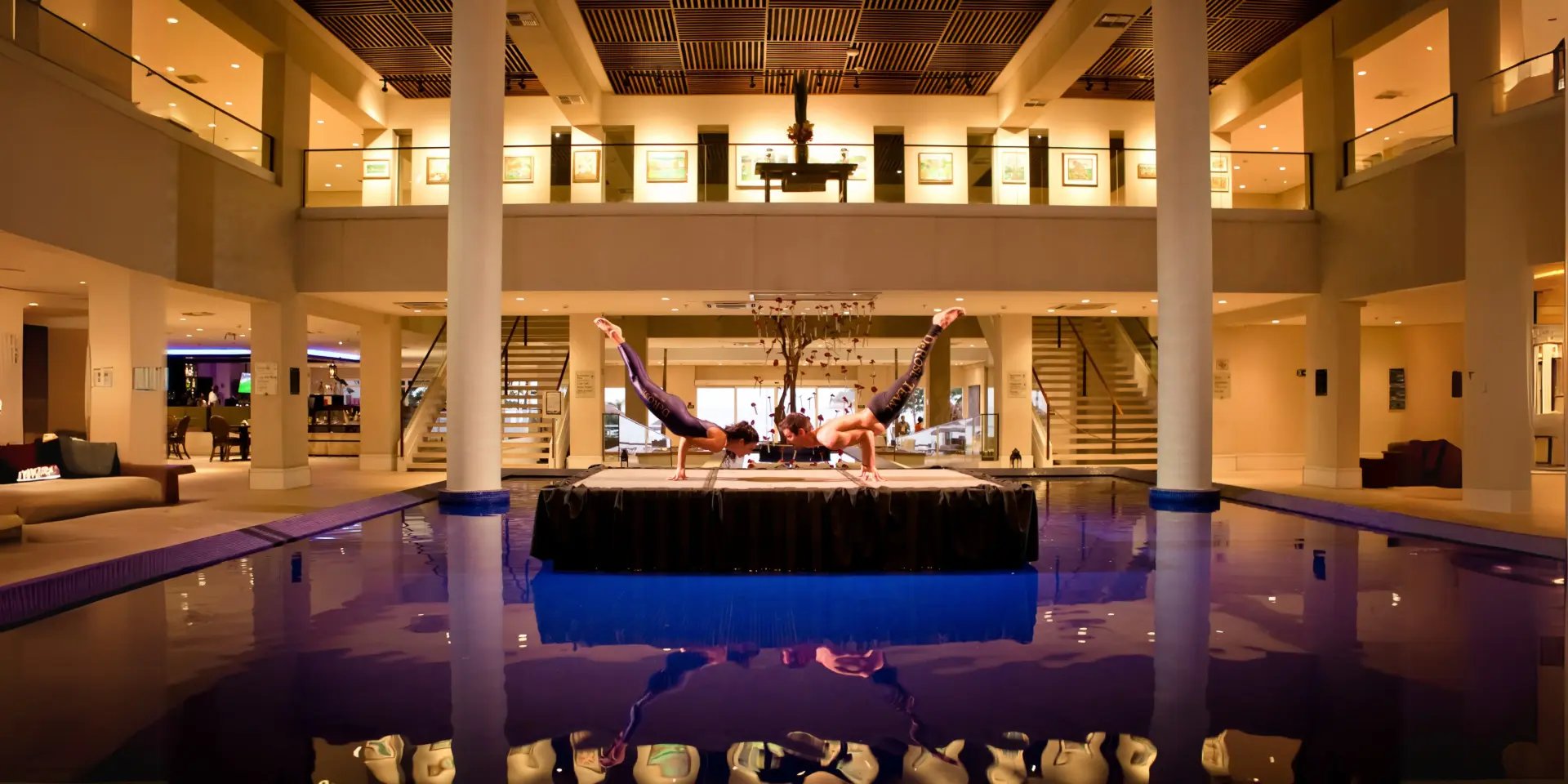 an abstract photo of a curved building with a blue sky in the background