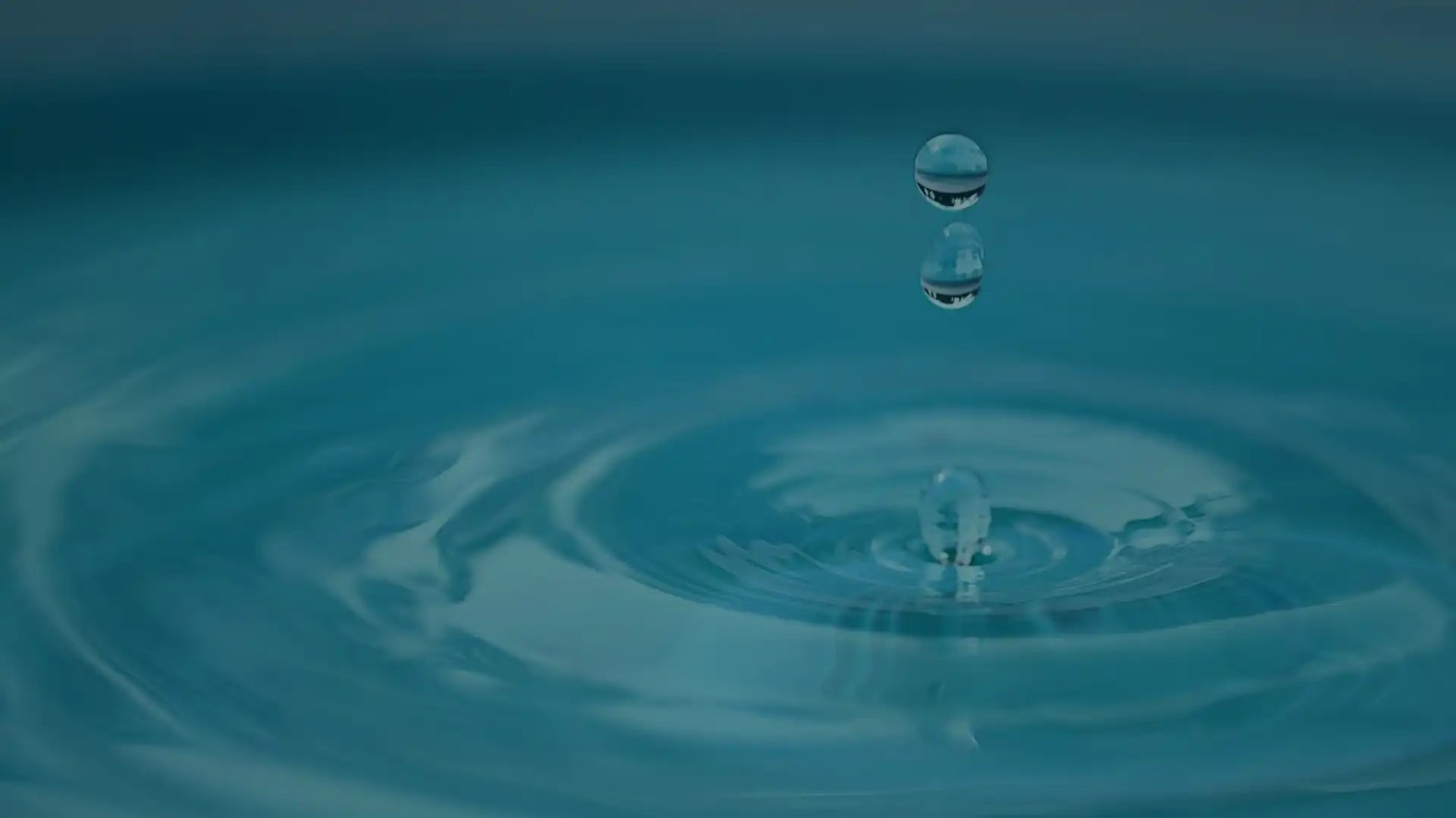 an abstract photo of a curved building with a blue sky in the background
