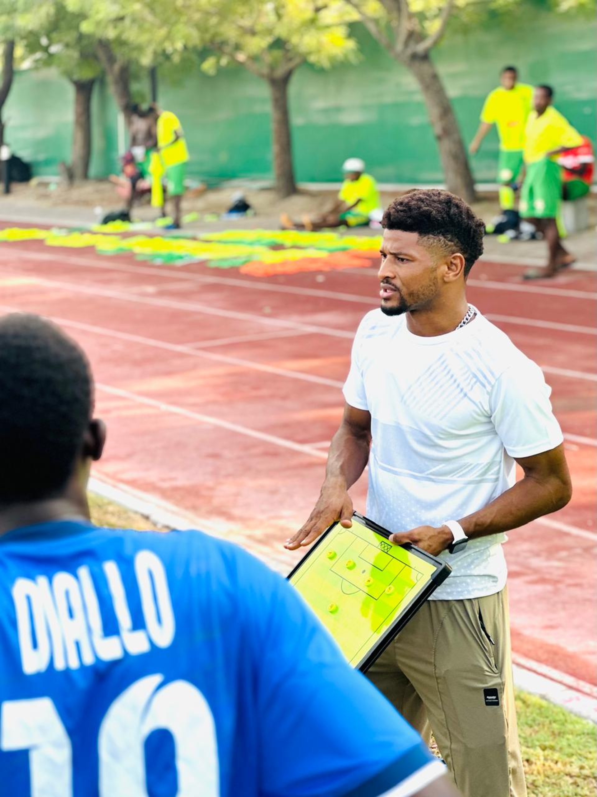 woman wearing yellow long-sleeved dress under white clouds and blue sky during daytime