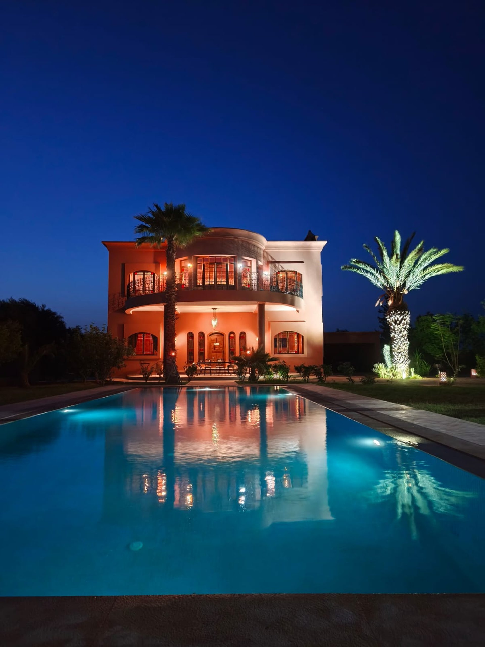 an abstract photo of a curved building with a blue sky in the background
