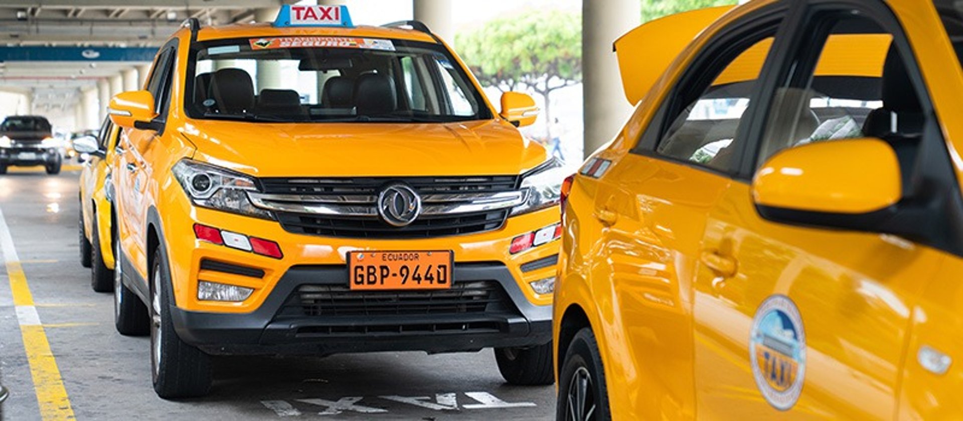 an abstract photo of a curved building with a blue sky in the background