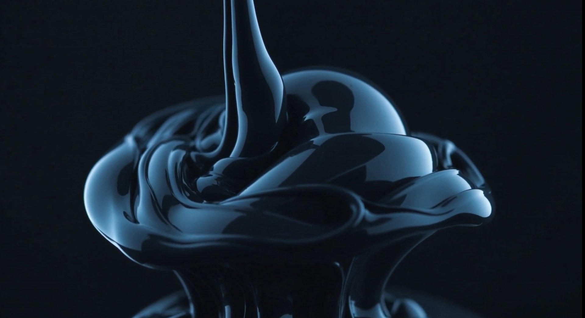 an abstract photo of a curved building with a blue sky in the background