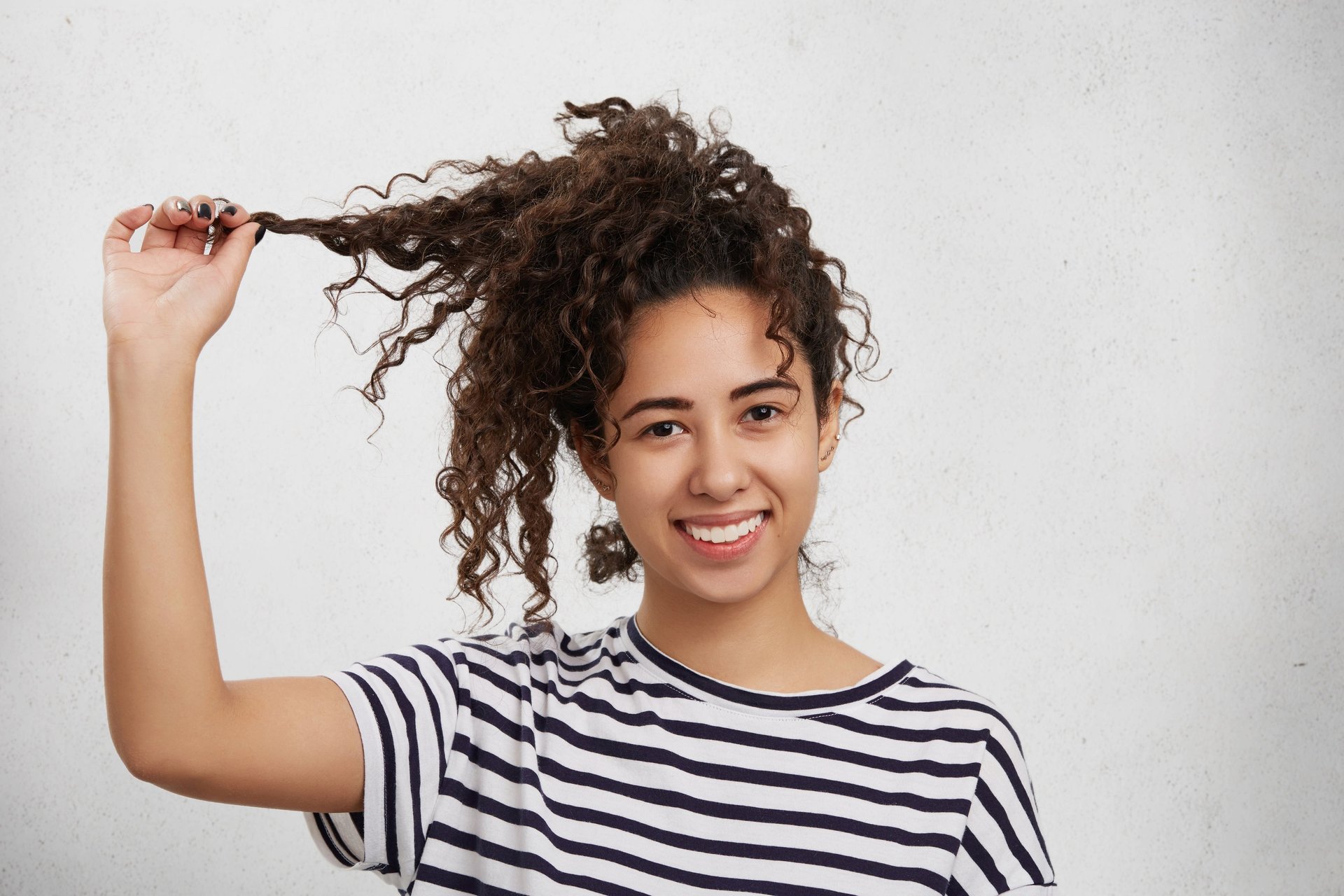 an abstract photo of a curved building with a blue sky in the background