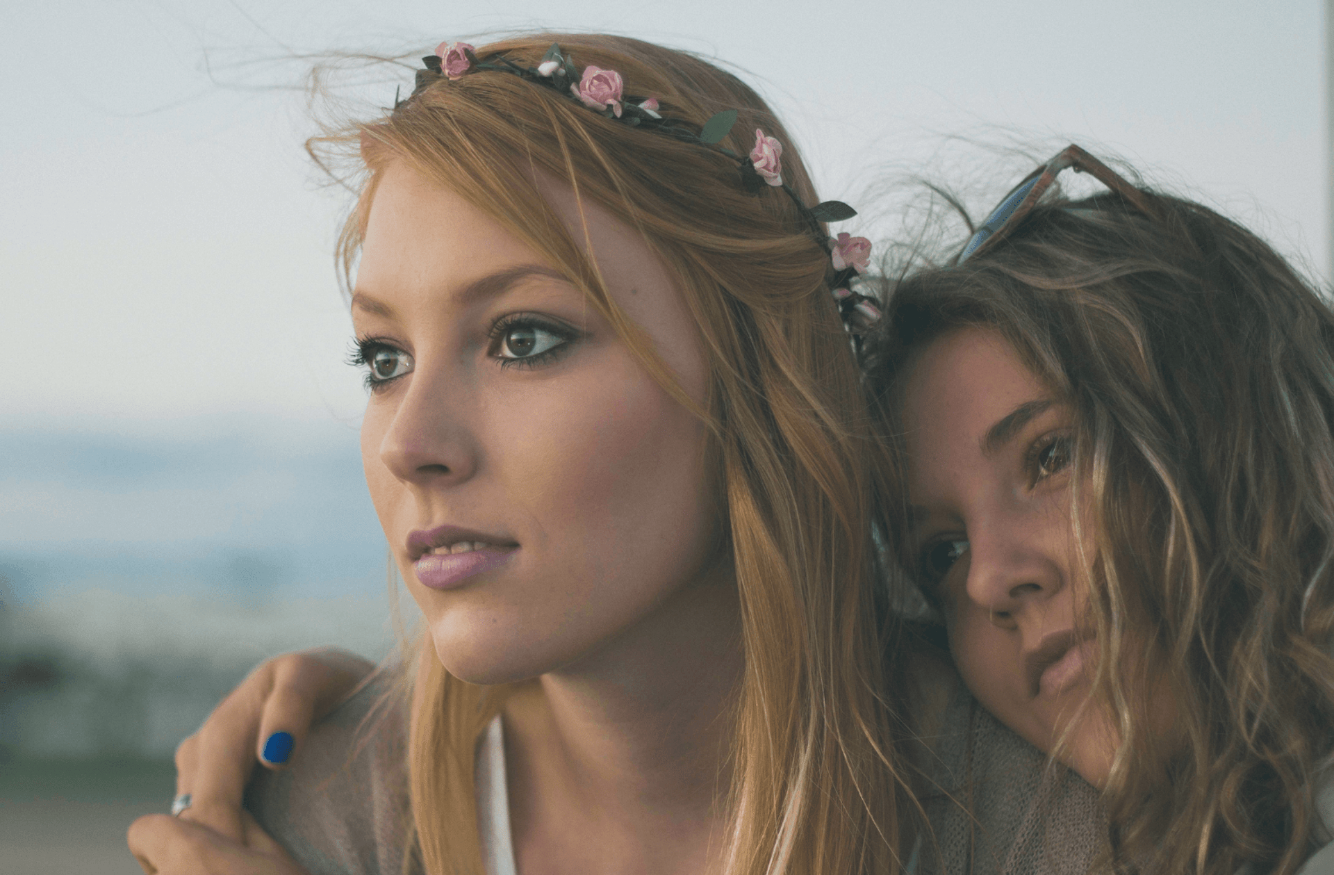 two women close up photography
