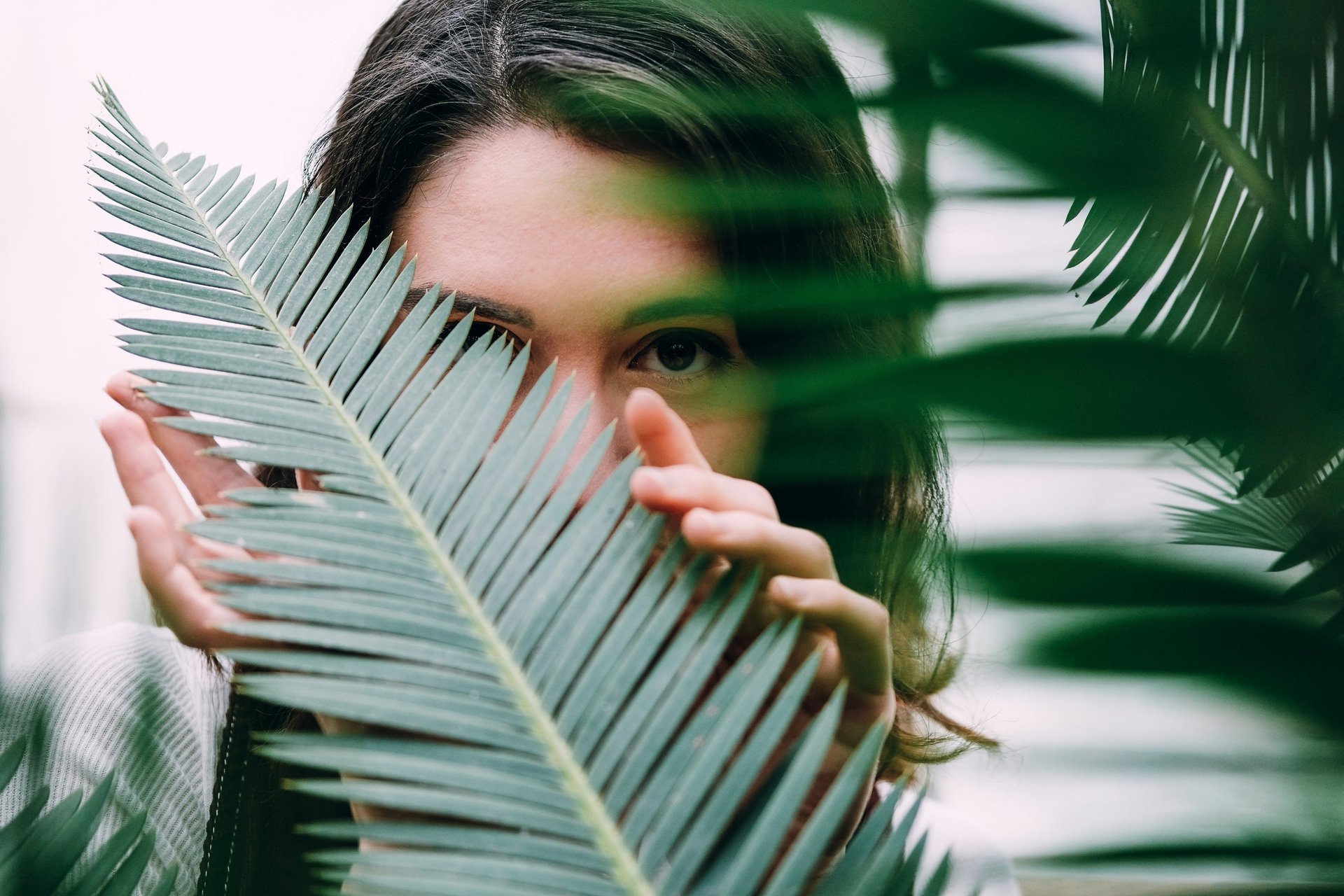 two women holding flowers